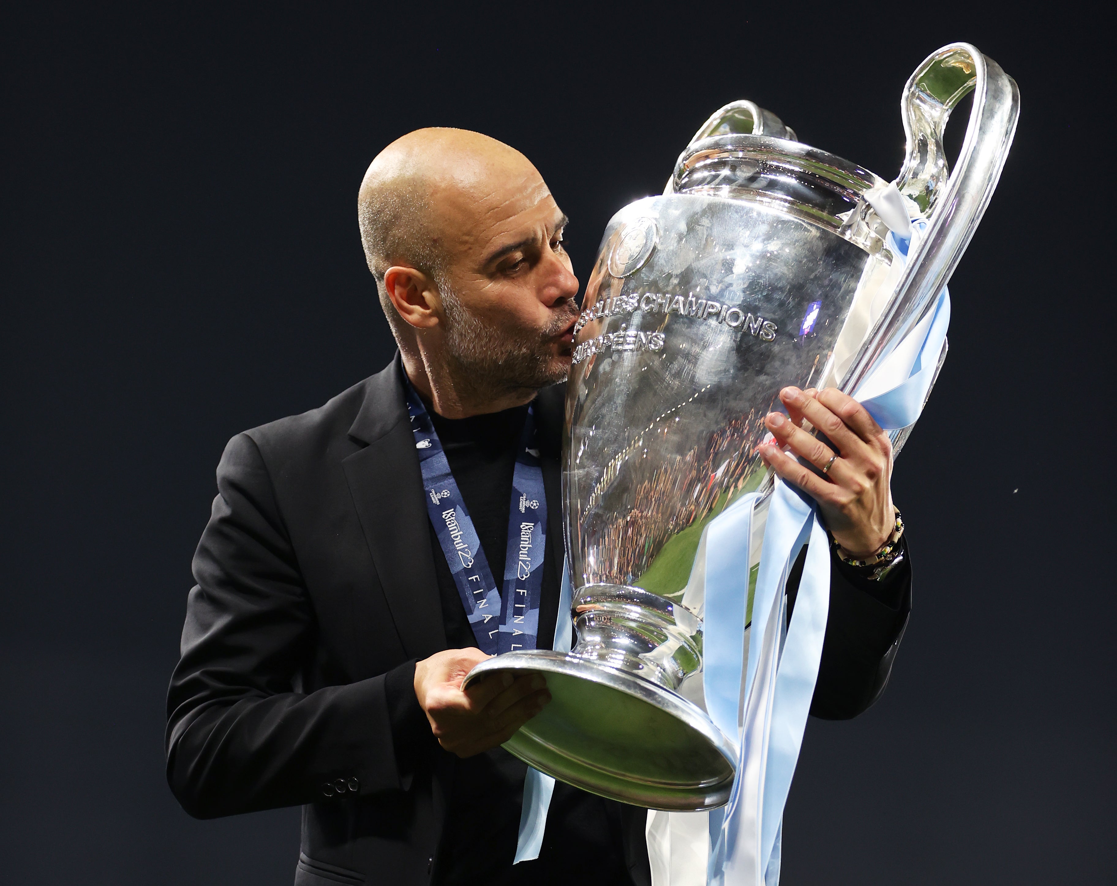 Pep Guardiola celebrates with the Champions League trophy