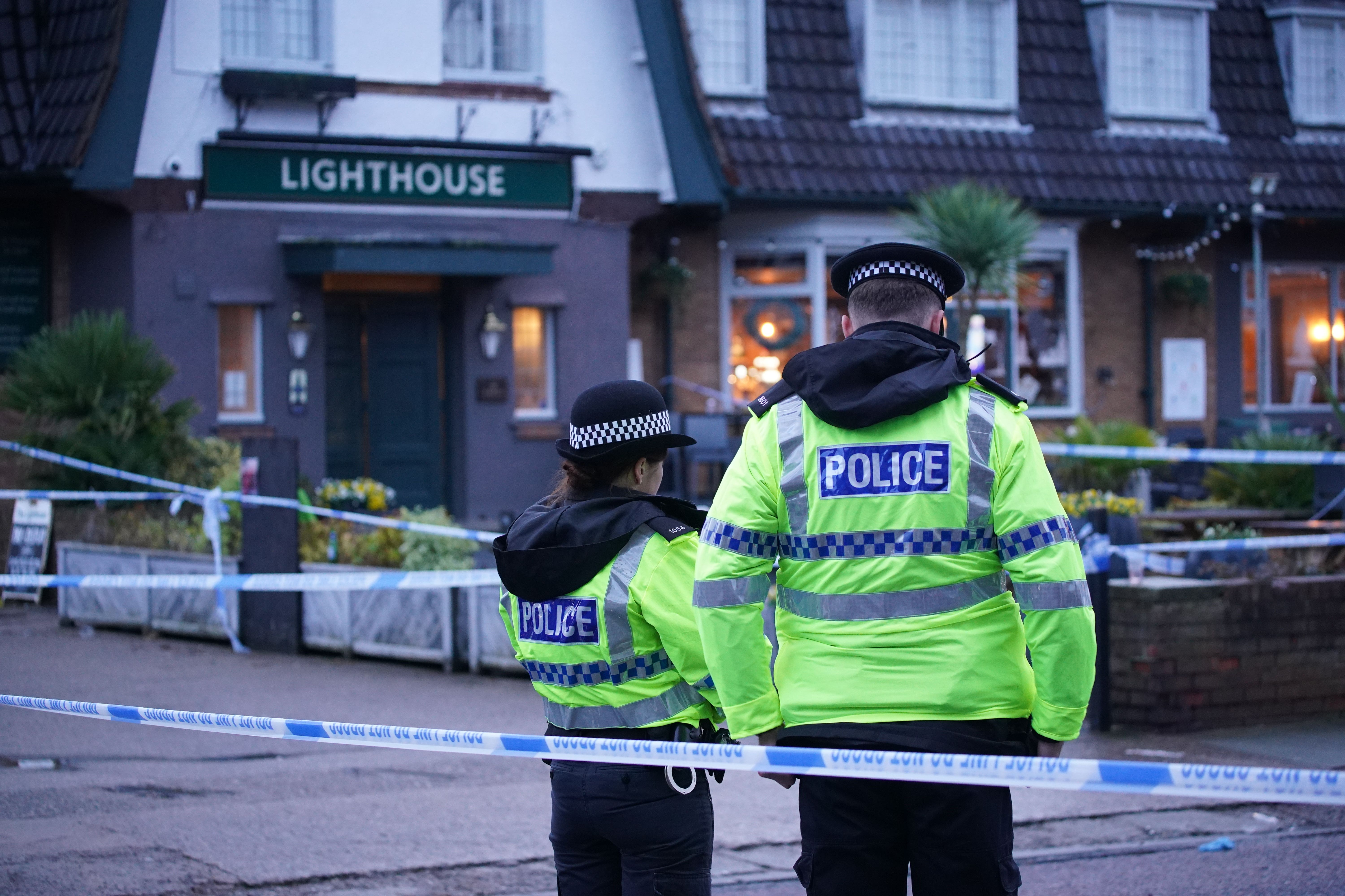 Police officers on duty at the Lighthouse Inn in Wallasey Village, Wirral (Peter Byrne/PA)