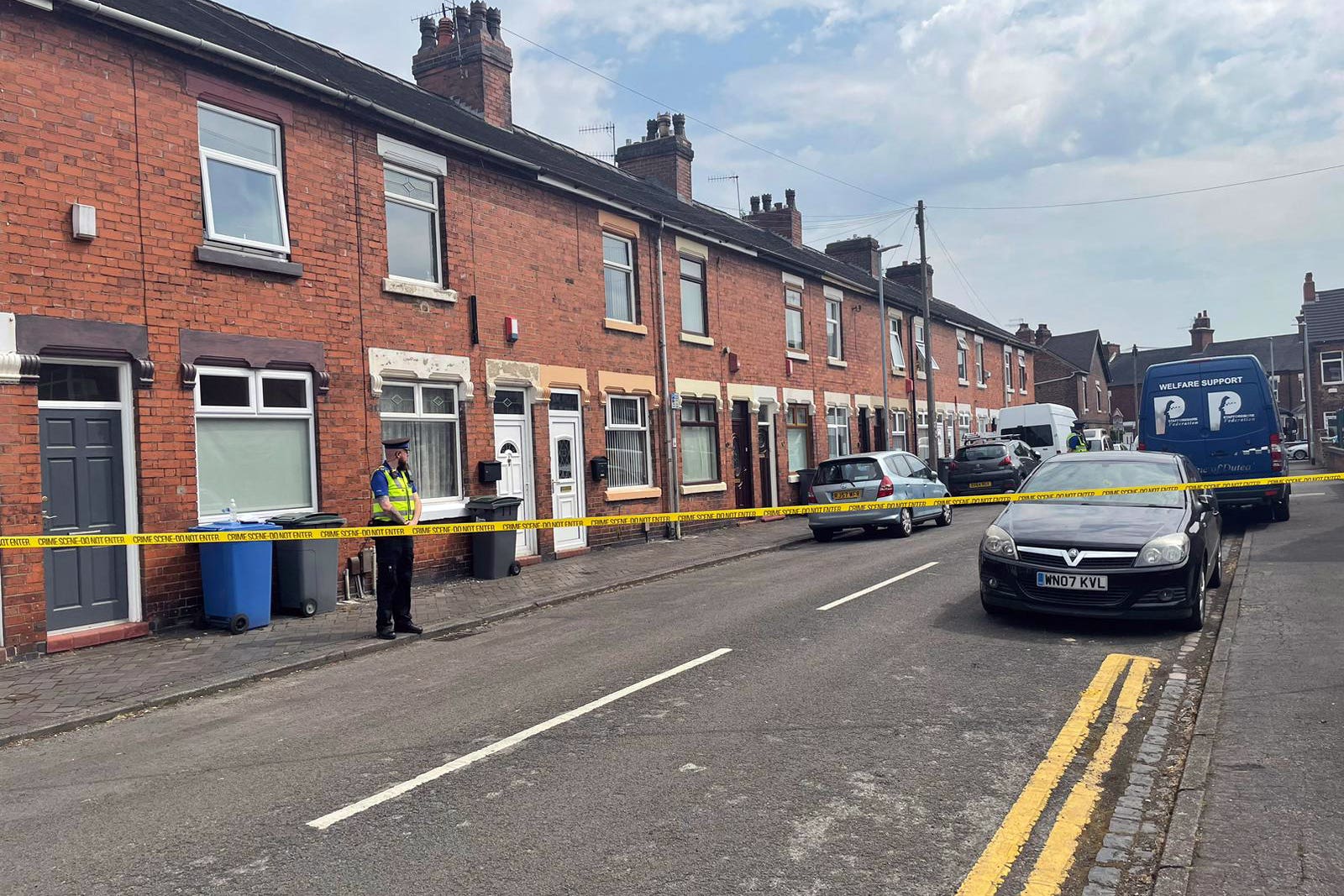 A police community support officer at the scene on Flax Street, Stoke-on-Trent, Staffordshire