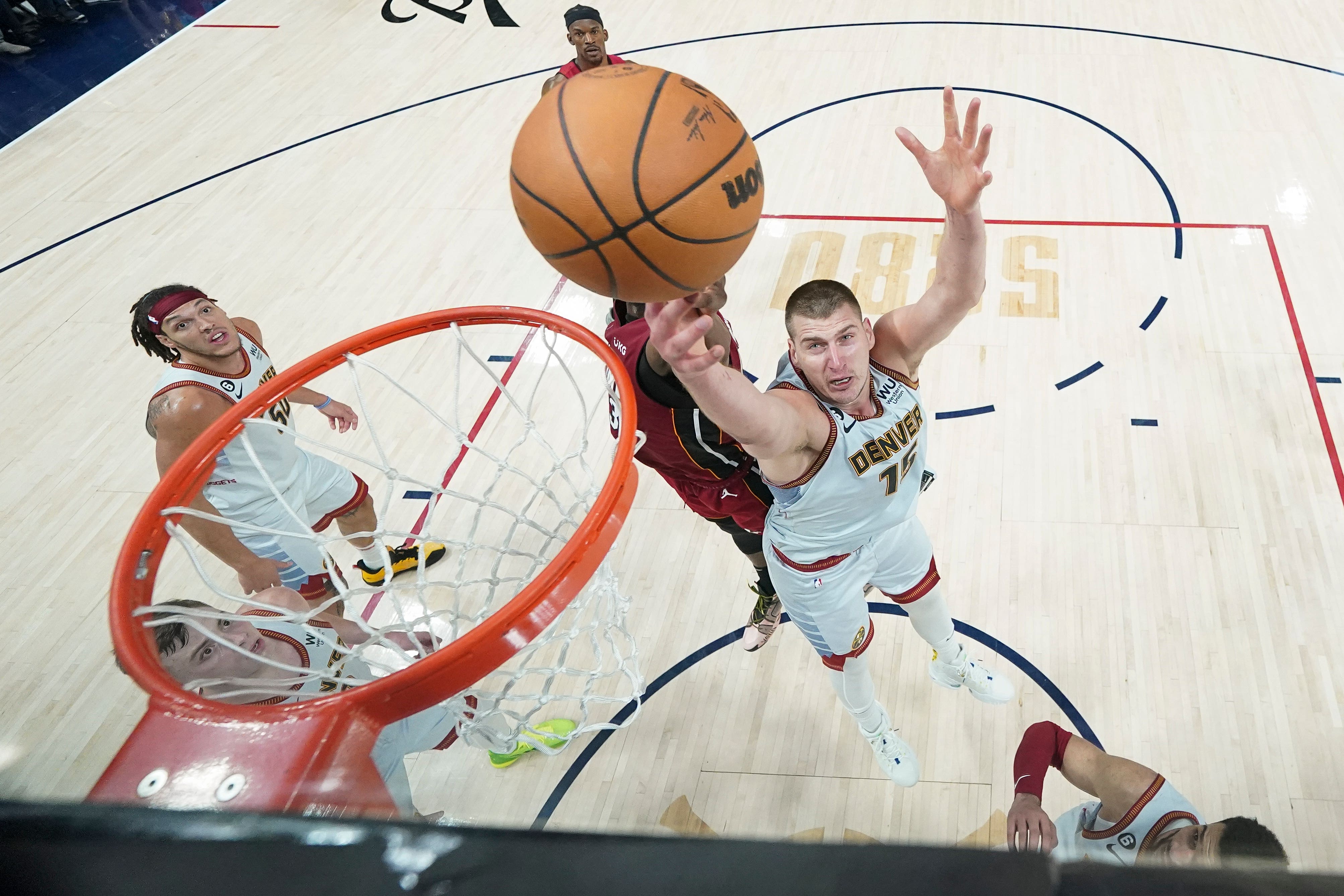 Jokic competes with Miami Heat centre Bam Adebayo during the NBA Finals