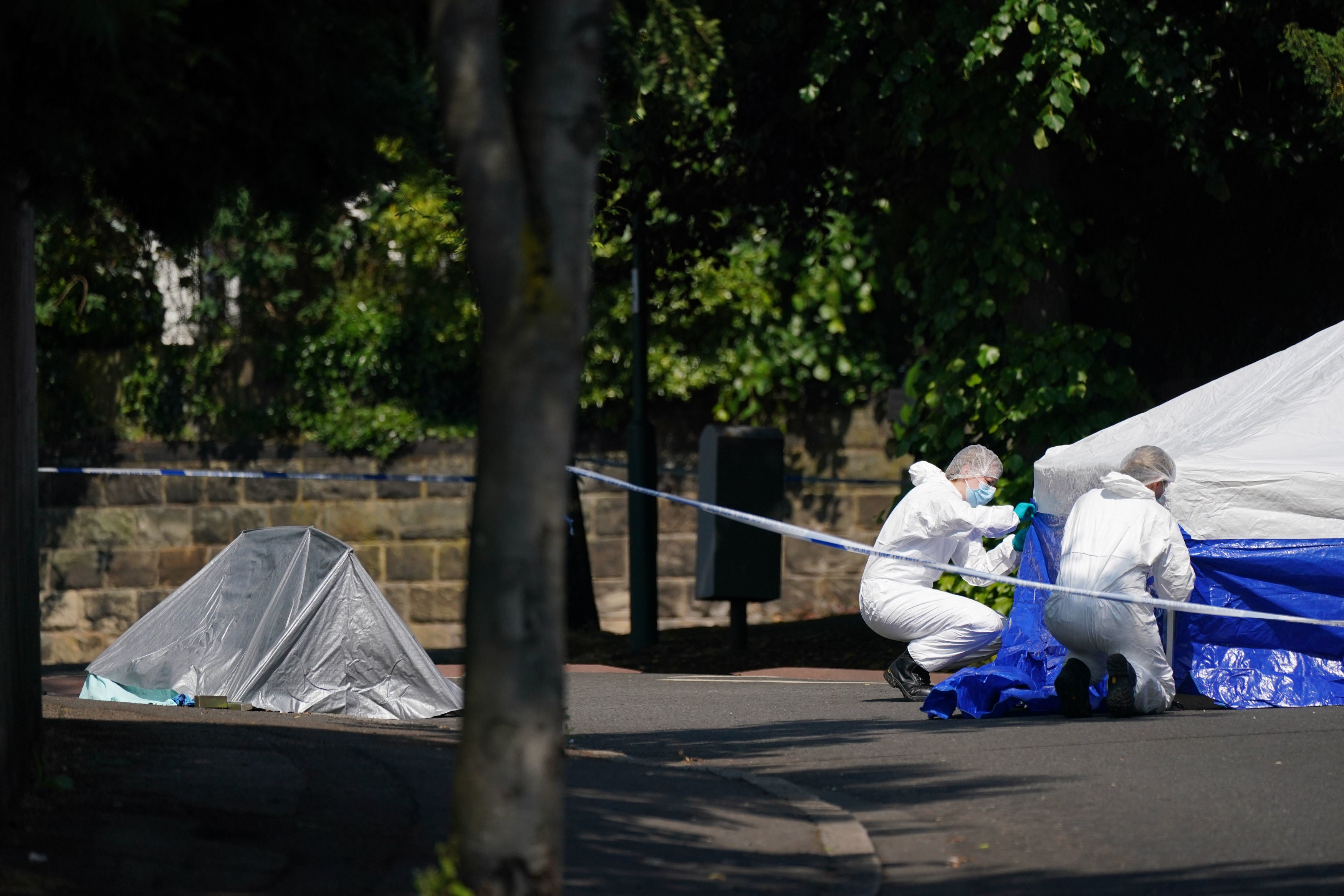 Police forensics officers on Magdala road, Nottingham, as a 31-year-old man has been arrested on suspicion of murder after three people were killed in Nottingham city centre