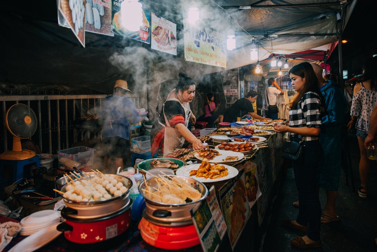 Indulge in delicious street food including pad Thai and moo ping