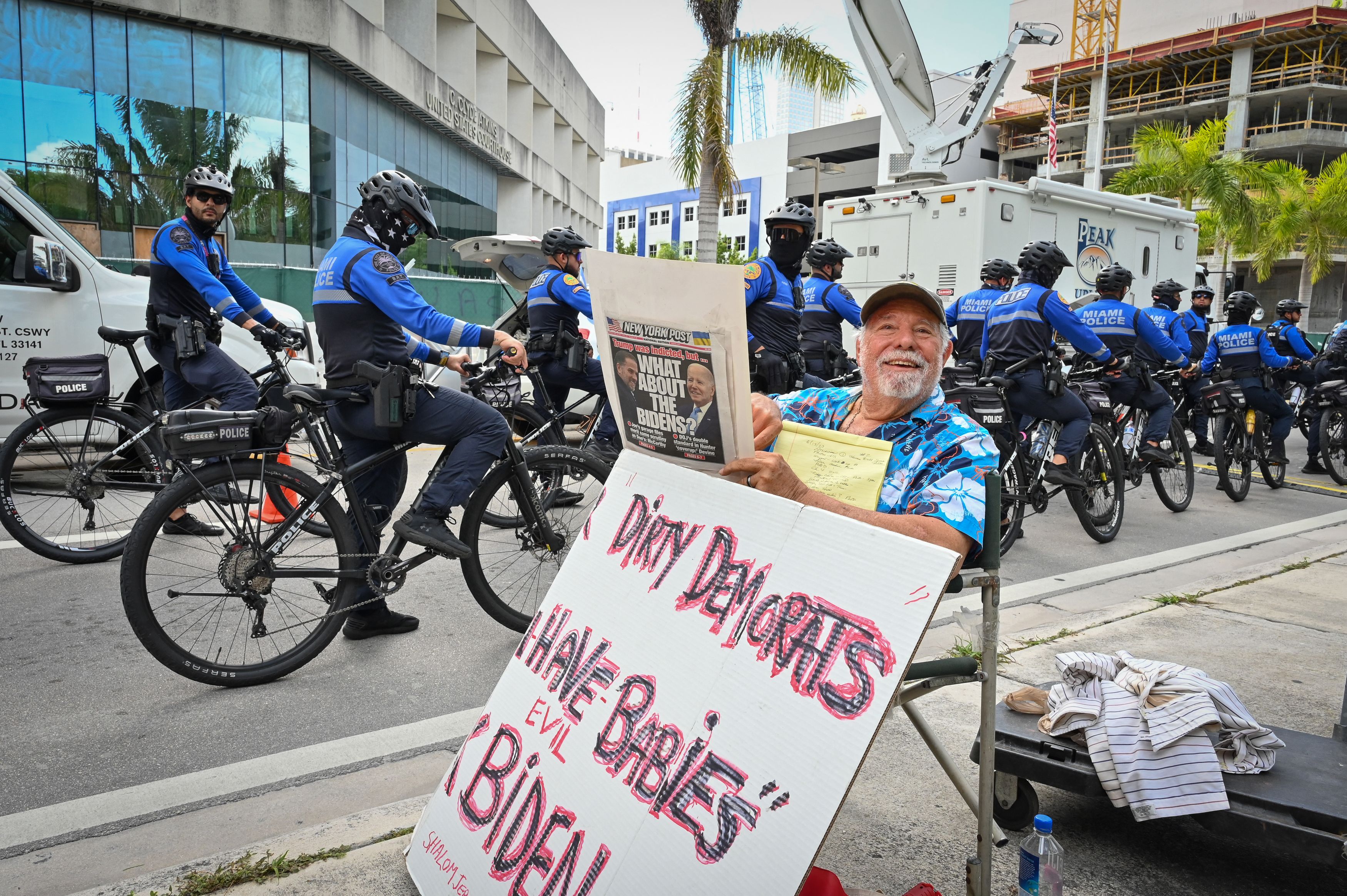 A Trump supporter shows his support in front of the Wilkie D. Ferguson Jr. United States Courthouse before the arraignment of former President Donald Trump in Miami, Florida on June 13, 2023