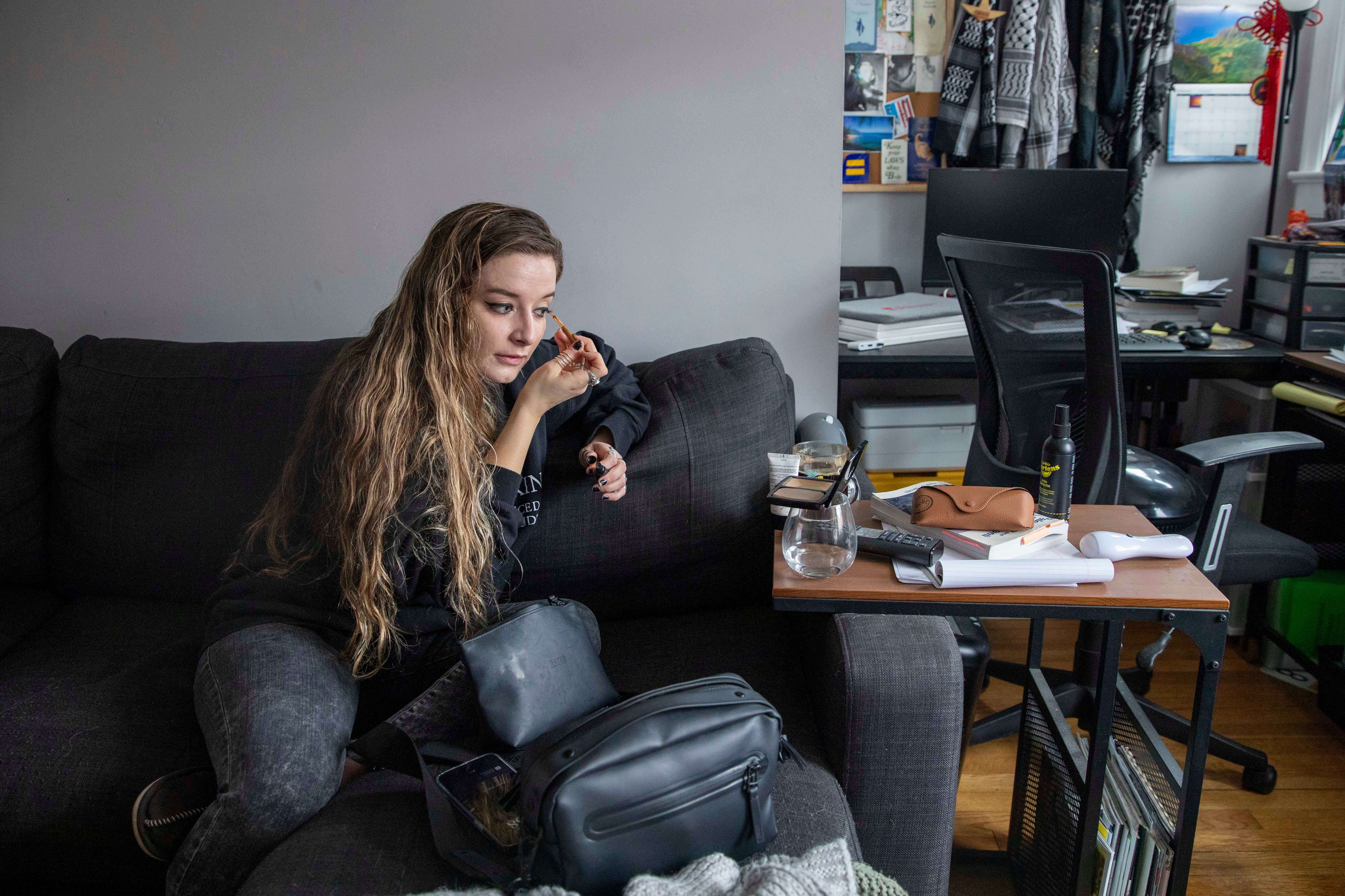 Amber Escudero-Kontostathis puts on make-up at her Washington home in March. She spent months recovering from physical and mental trauma after she was struck by lightning last August