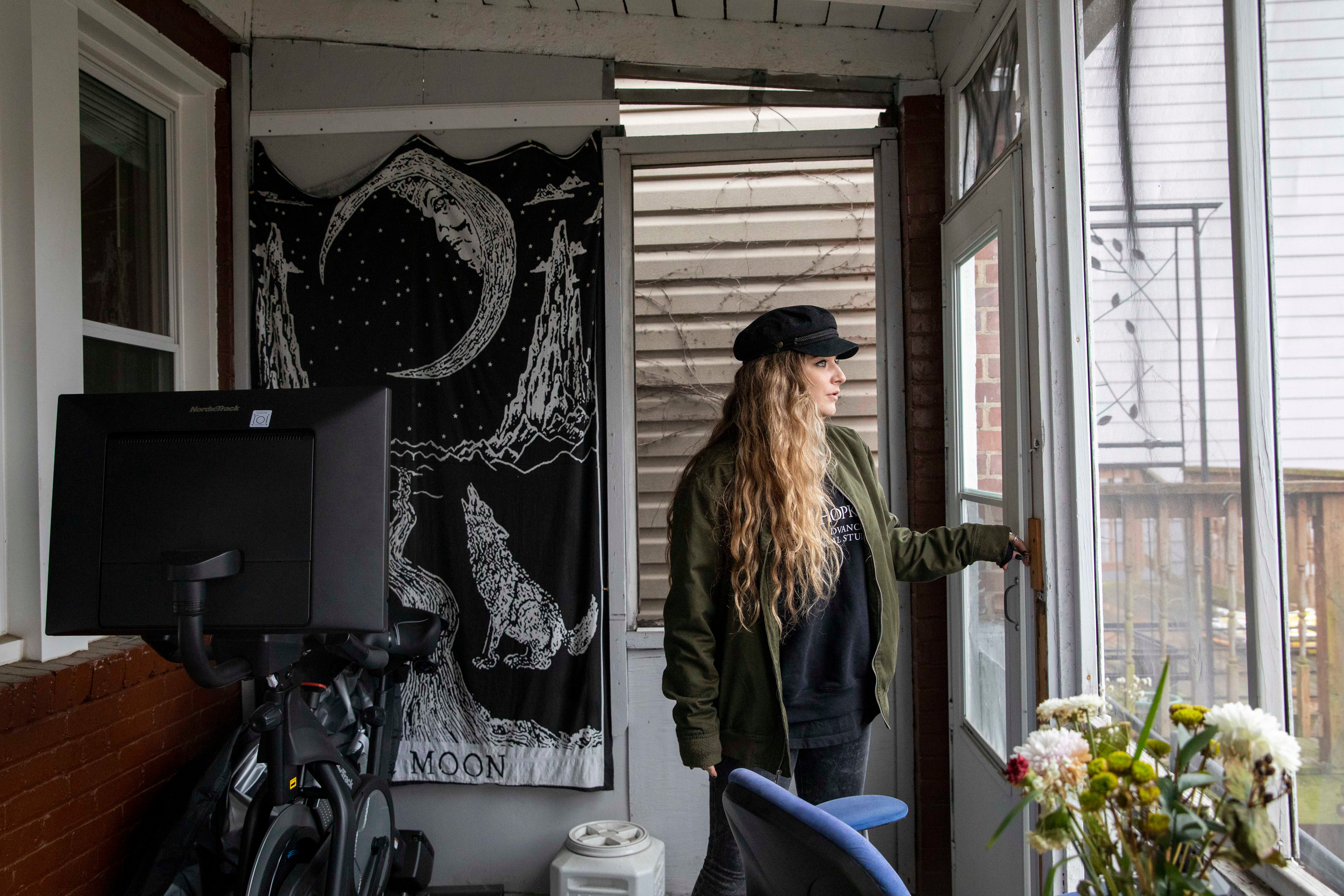 Amber Escudero-Kontostathis looks over her backyard at her home in Washington on 10 March