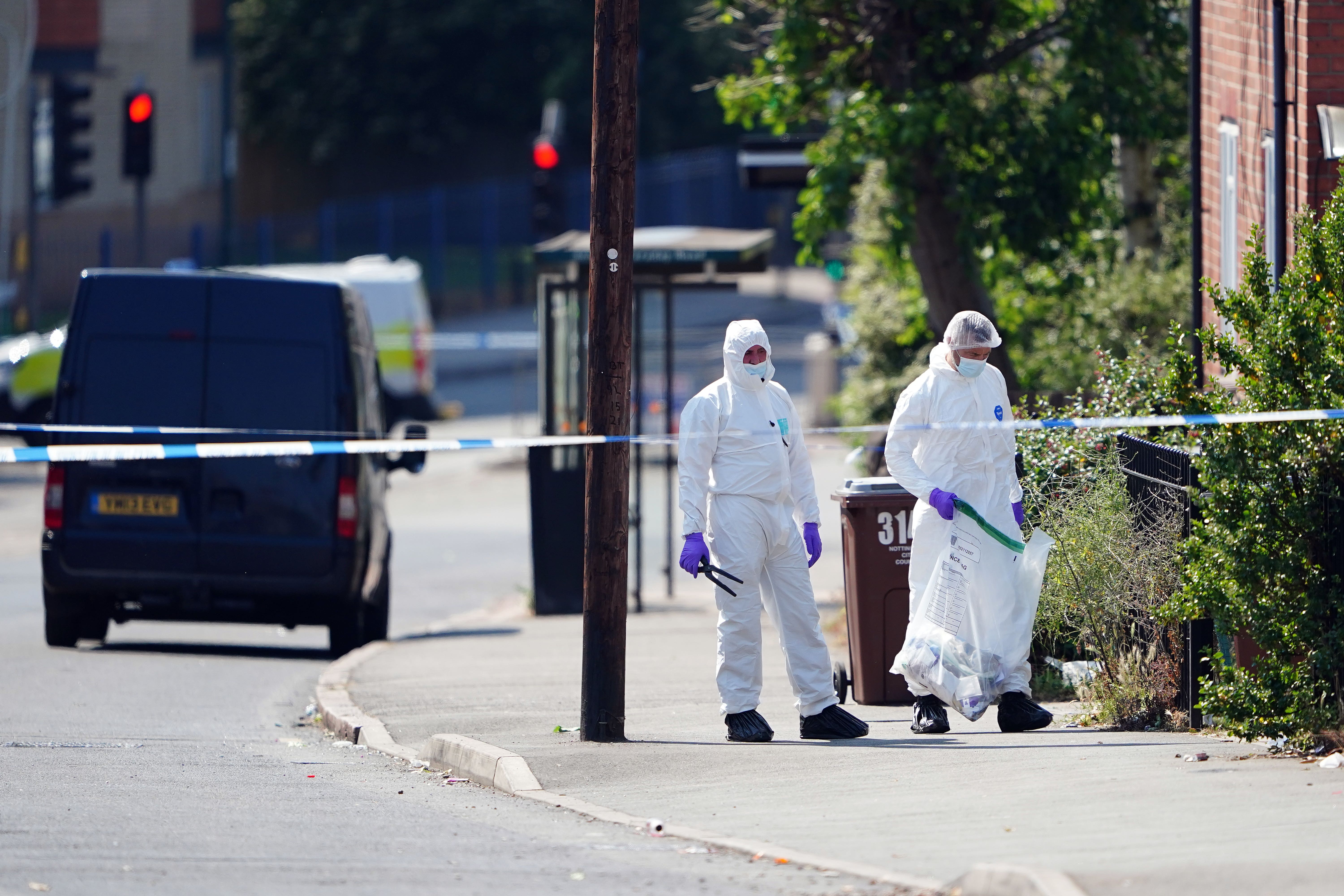 Police forensics officers on Ilkeston Road, Nottingham (Zac Goodwin/PA)