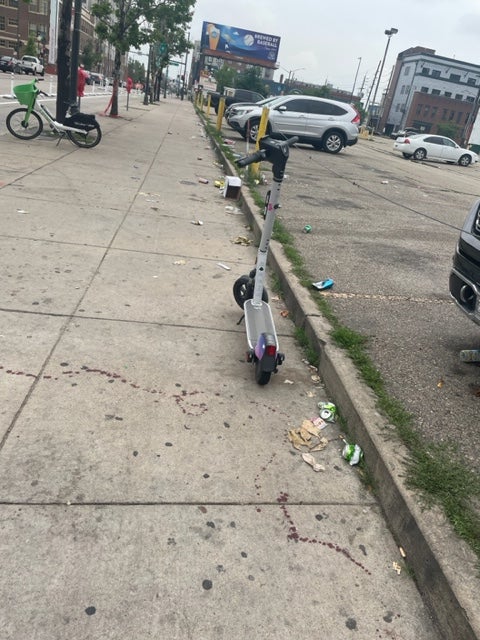 Trails of blood remained visible Tuesday morning after an overnight shooting left ten people injured, including one suspect and several innocent bystanders, in downtown Denver