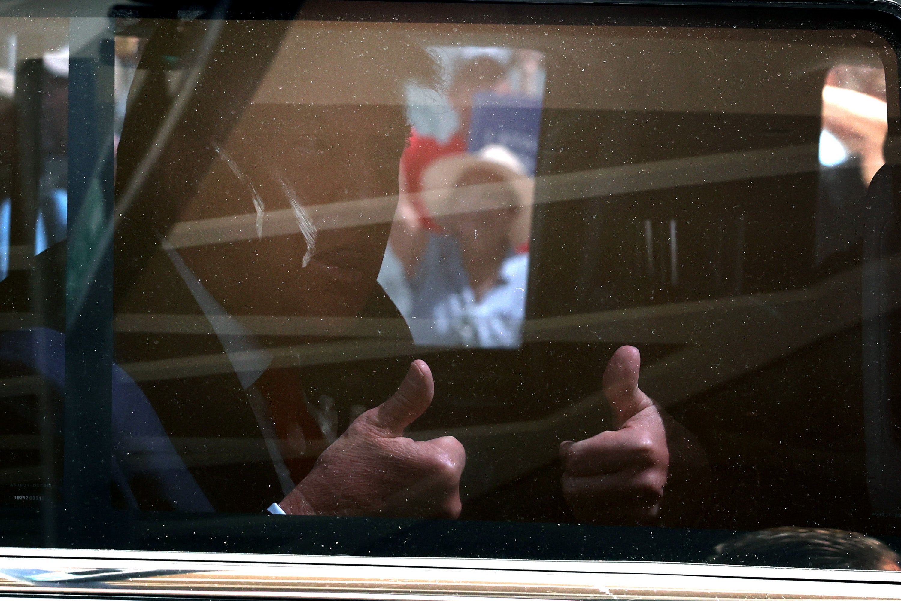 Donald Trump gives a thumbs up as his motorcade leaves federal court in Miami on 13 June after he pleaded not guilty to 37 charges in a sweeping indictment accusing him of illegally retaining classified documents and obstructing government efforts to retrieve them.