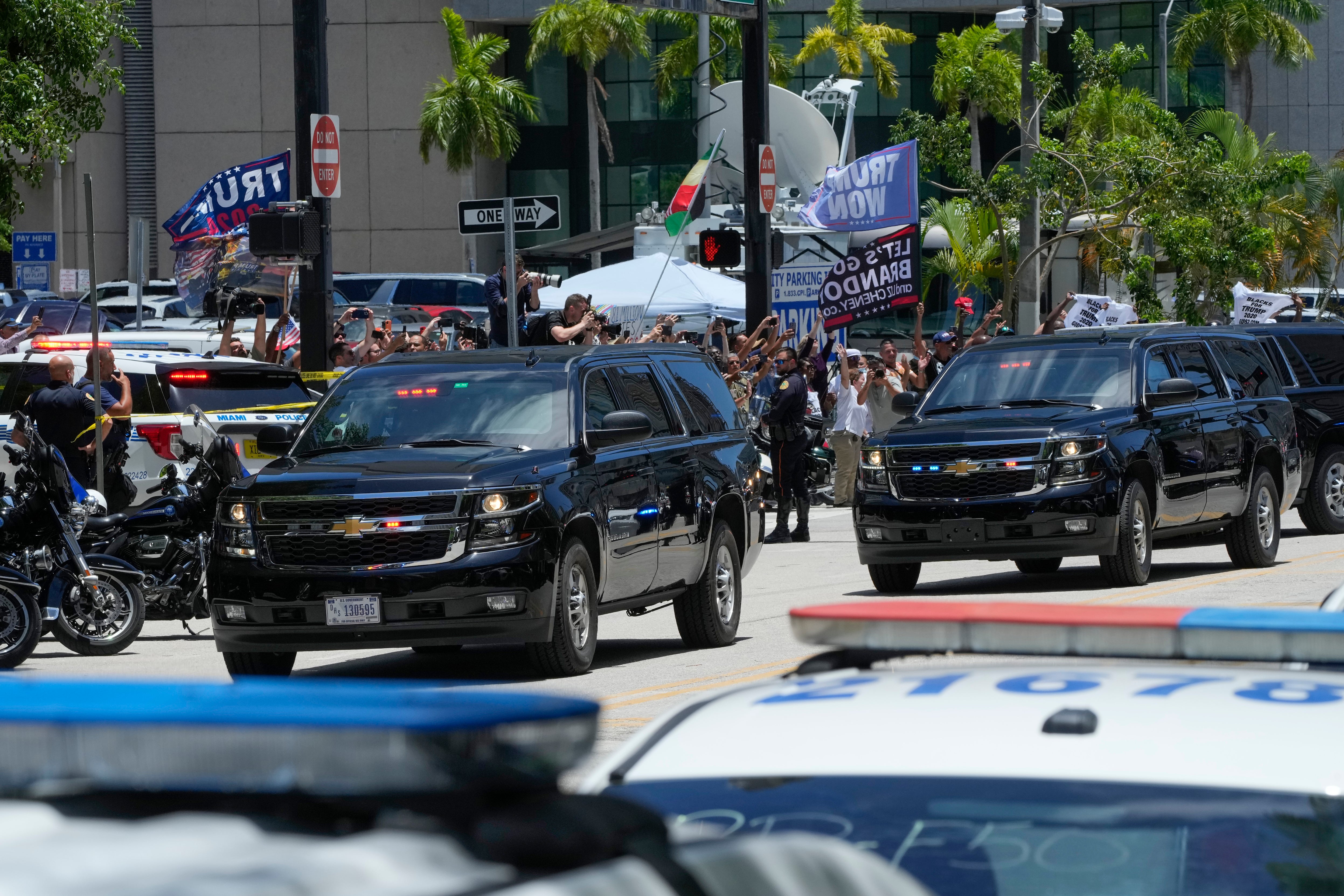 Caravan of Secret Service vehicles transports Donald Trump to and from his arraignment on 13 June