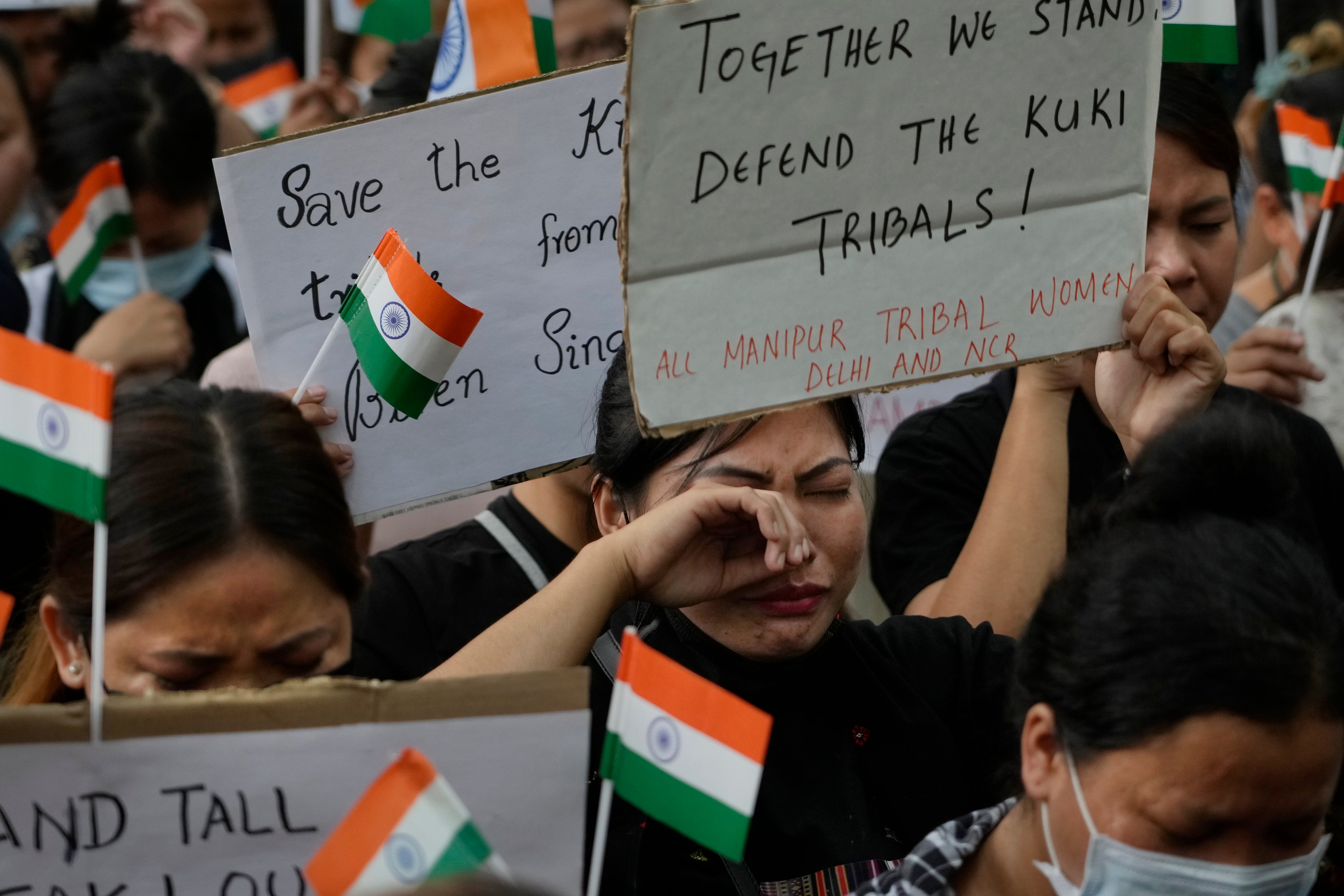 A member of the Kuki tribe cries during a sit in protest against the killing of tribals in their northeastern home state of Manipur