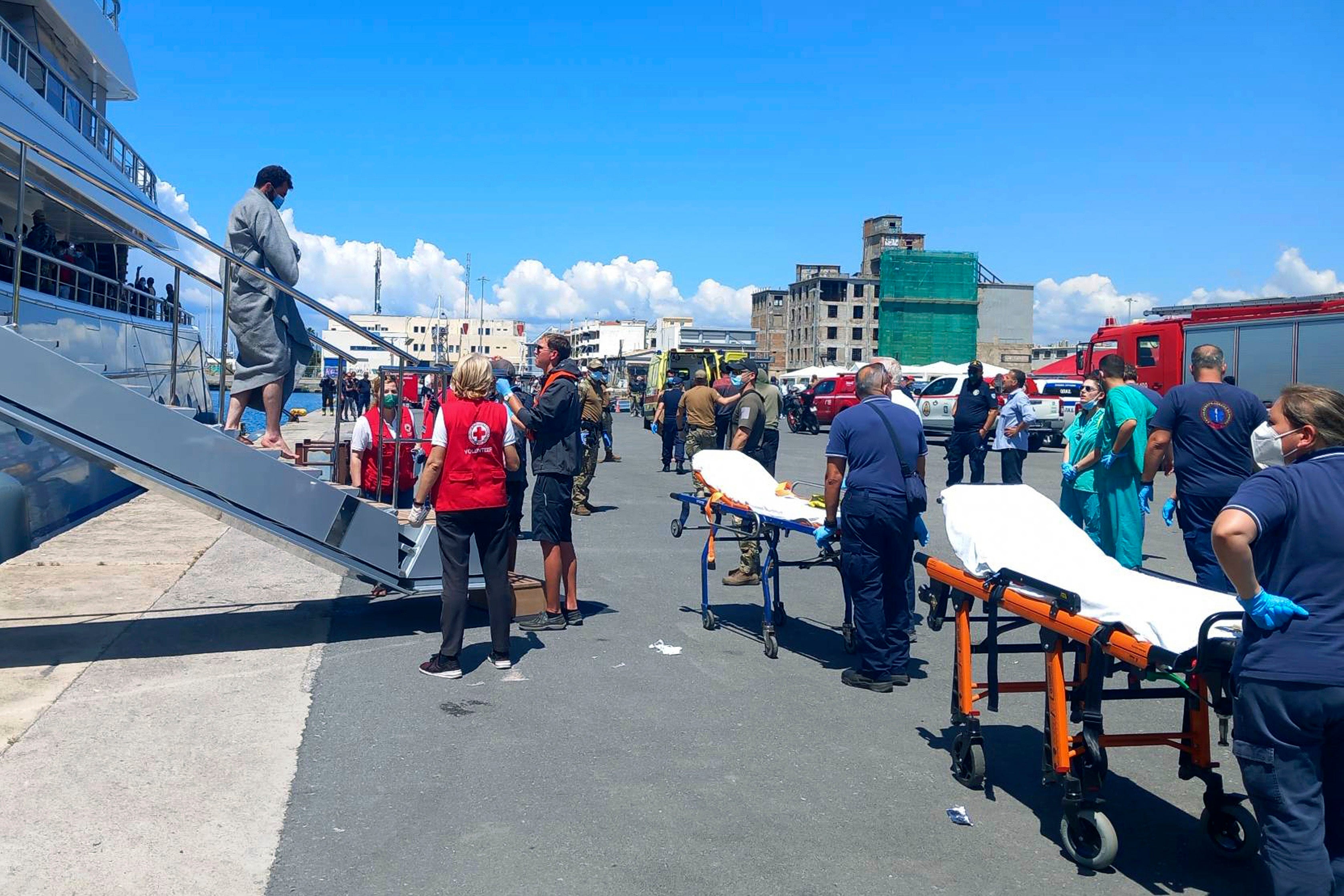 Survivors arrive at the port in Kalamata