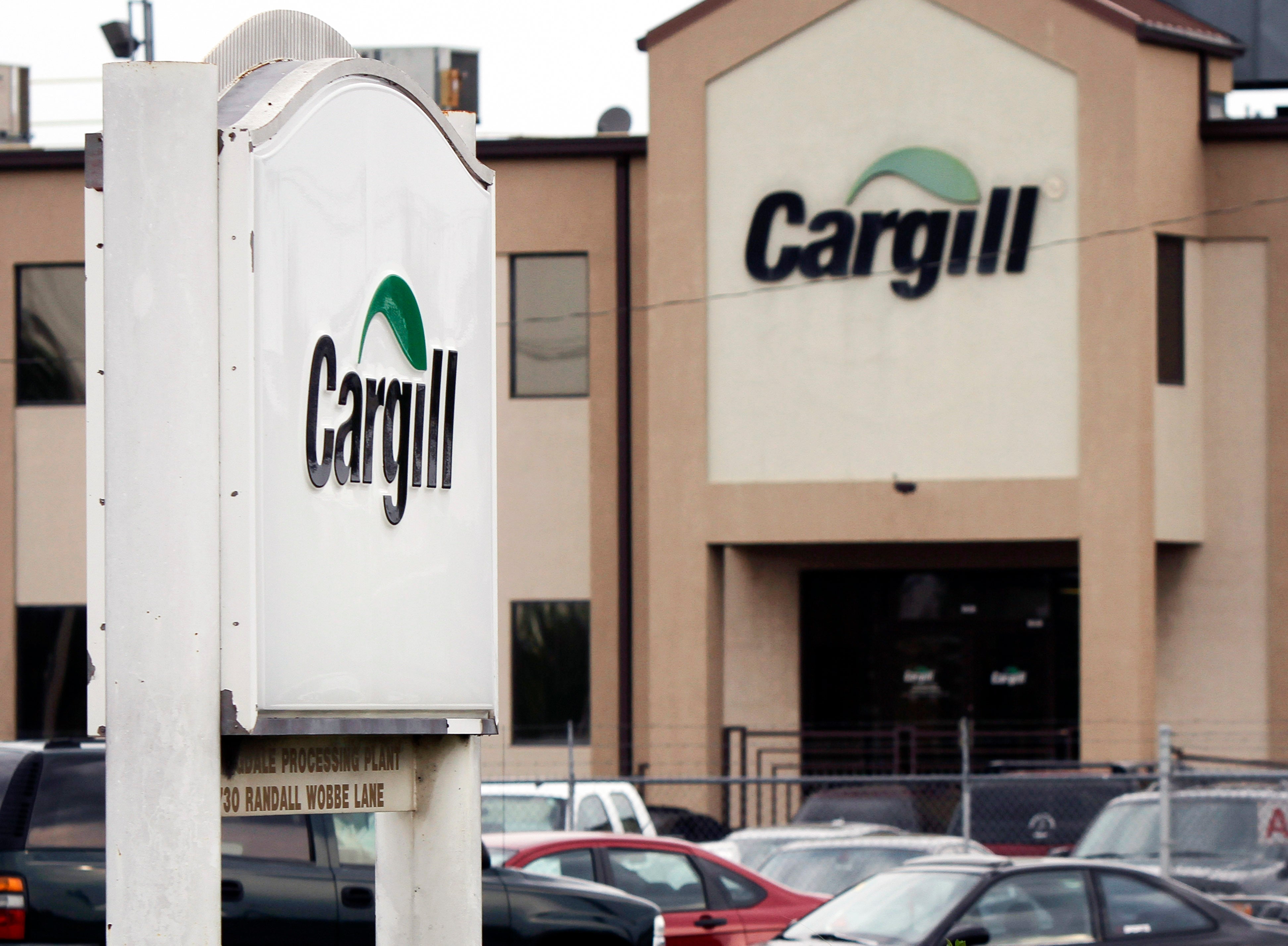 Cars sit parked at a Cargill Inc., turkey processing plant on Aug. 4, 2011, in Springdale, Arkansas