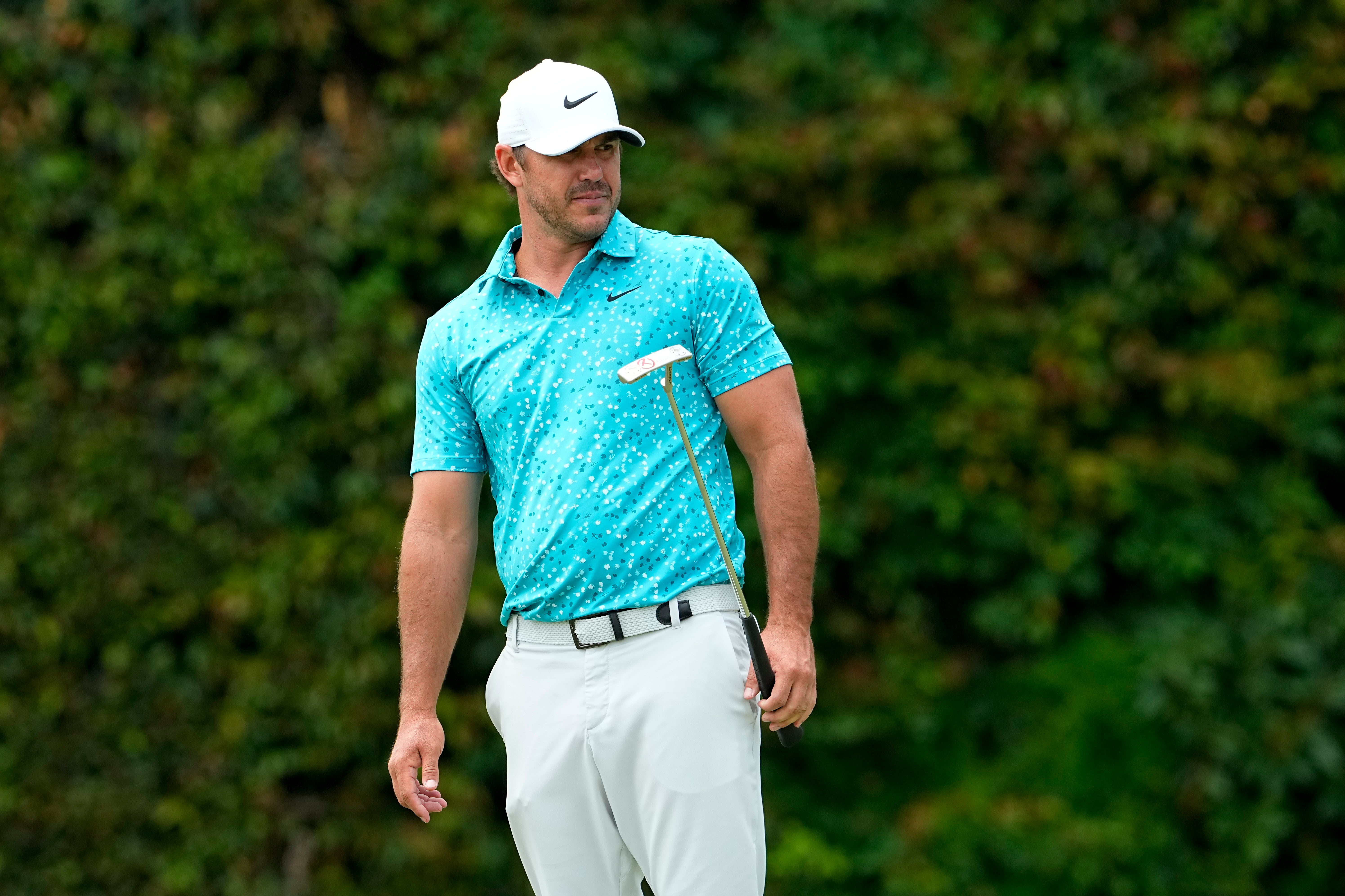 Brooks Koepka watches his putt on the 13th hole during a practice round for the US Open