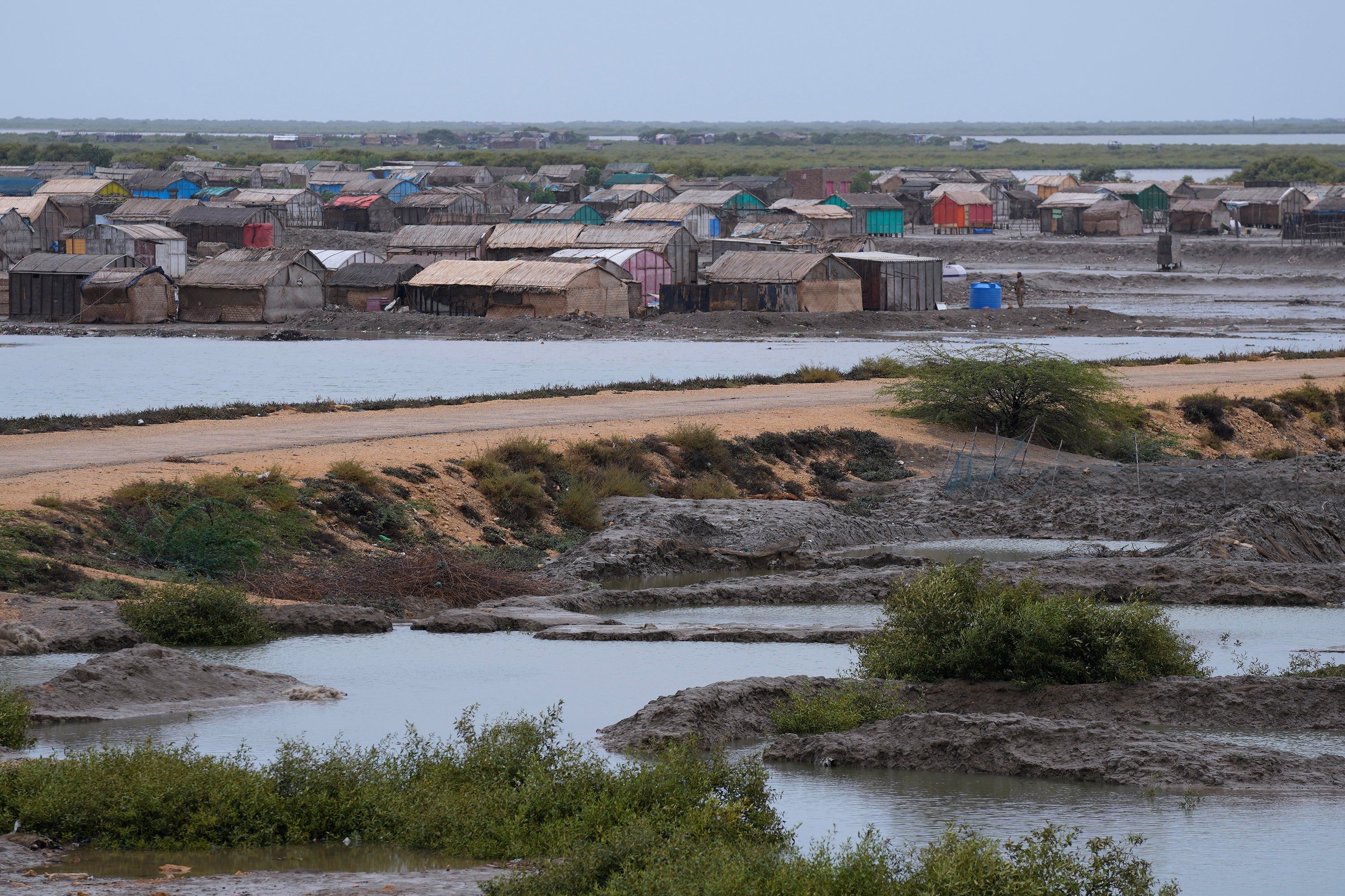 A paramilitary soldier searches an empty village to ensure everybody have been evacuated due to Cyclone Biparjoy approaching, in Keti Bandar near Thatta, Pakistan