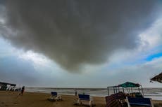 Cyclone Biparjoy – live: Storm begins landfall in India as Pakistan braces for ferocious winds and downpours