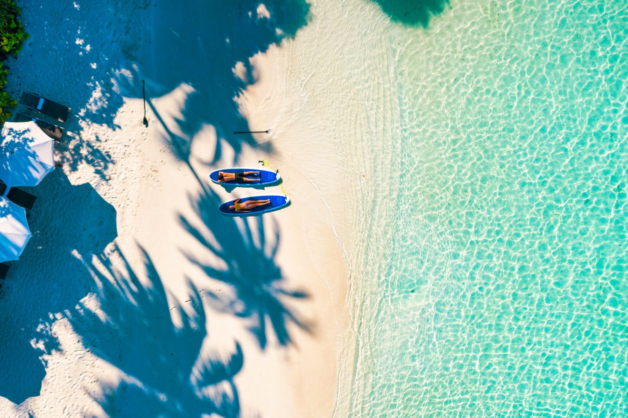 Spend time together under the palms on white sands from Bora Bora to the Maldives