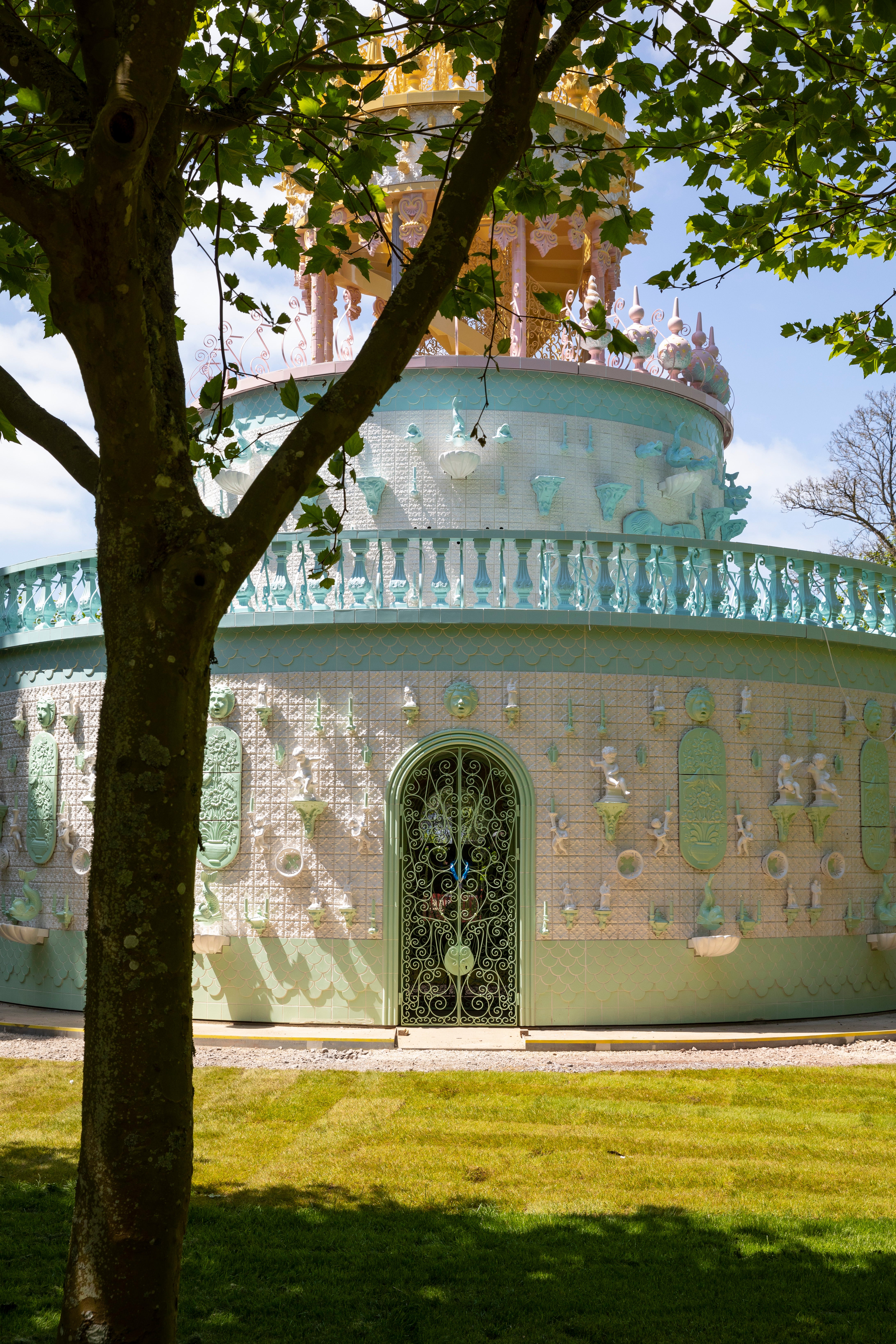 ‘Kitsch and beautiful’: the 12m-high ‘Wedding Cake’ has mermaids and electric candles