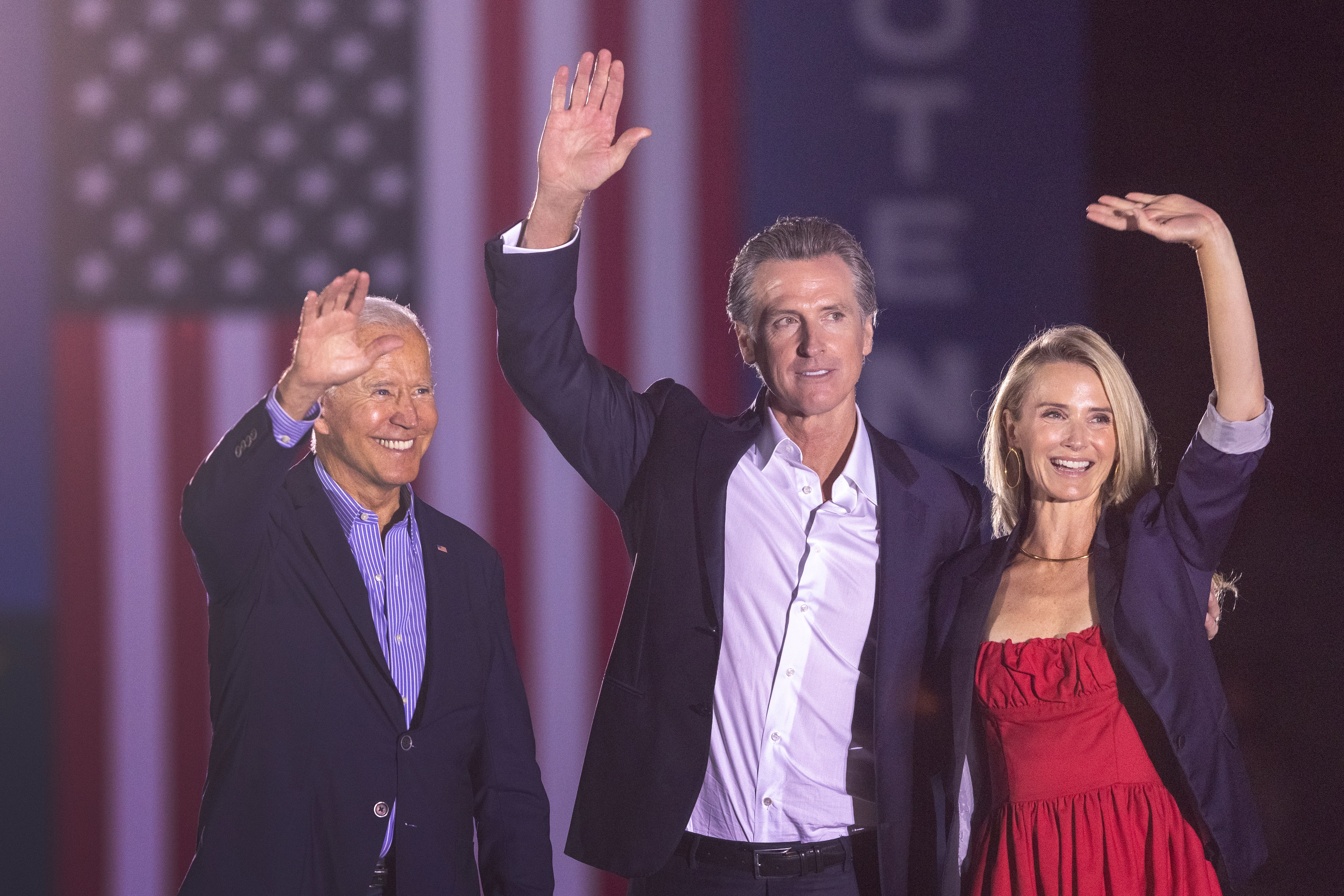 U.S. President Joe Biden, California Gov. Gavin Newsom and Jennifer Siebel Newsom wave to the crowd as they campaign to keep the governor in office at Long Beach City College on the eve of the last day of the special election to recall the governor on September 13, 2021 in Long Beach, California.