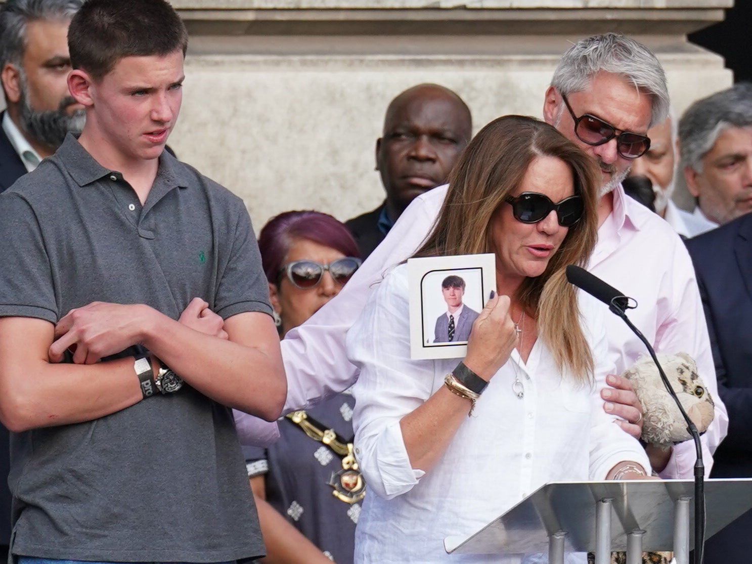 Emma Webber, the mother of Barnaby Webber, speaks during a vigil in Old Market Square