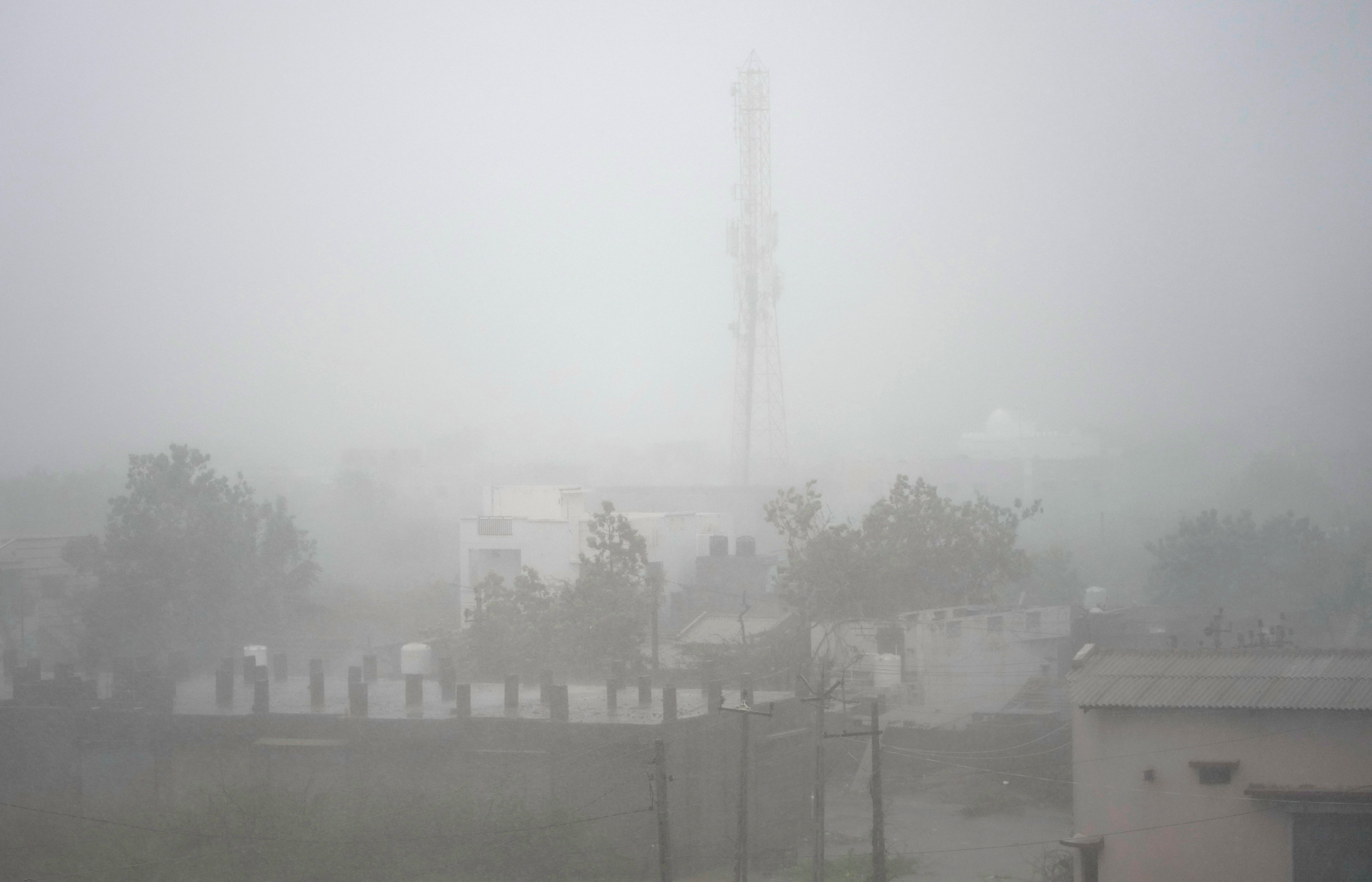 Cyclone Biparjoy kills two, uproots power lines after landfall in India and churns toward Pakistan