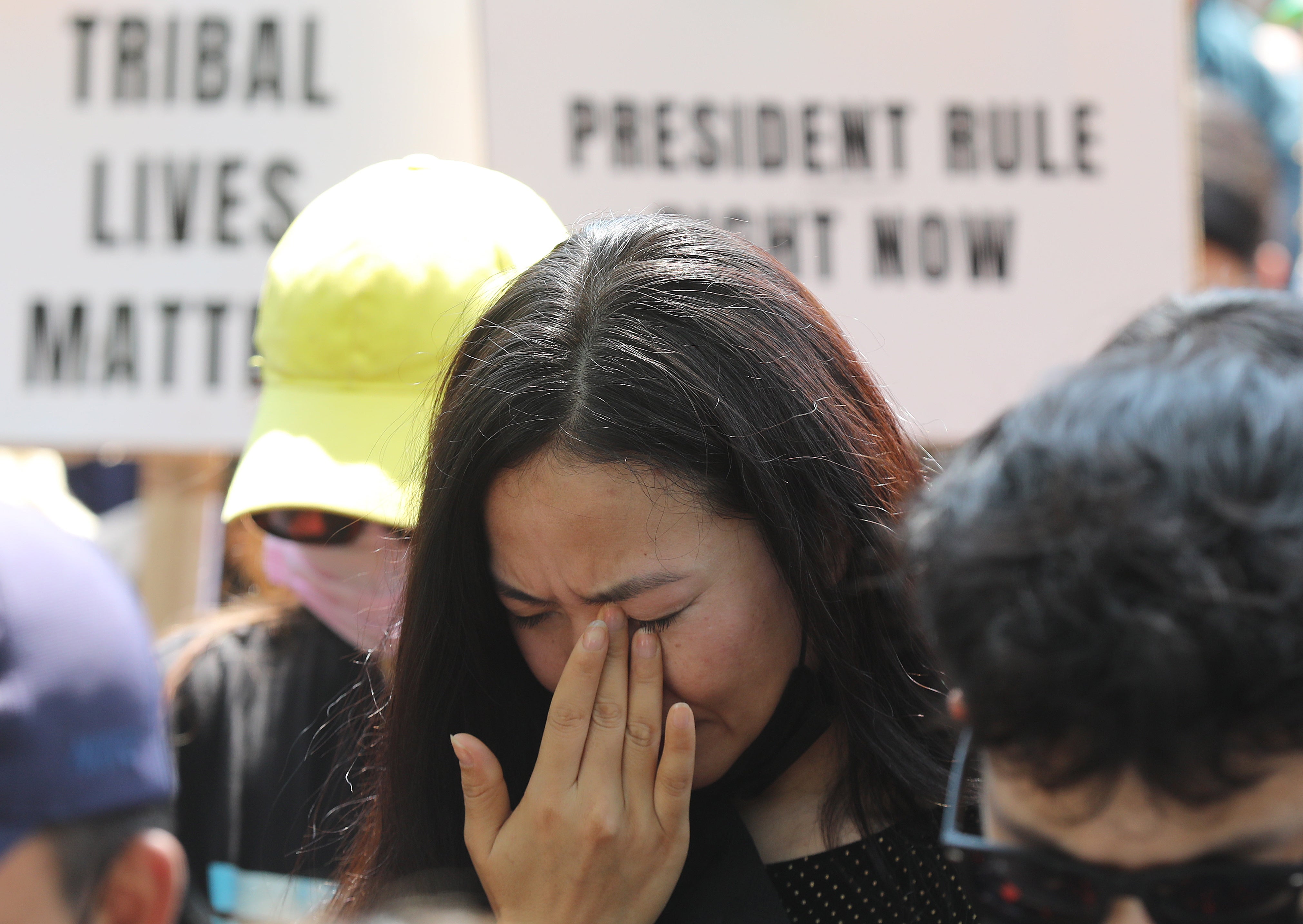 A member of the Kuki tribe reacts as she takes part in a tribal solidarity protest against the alleged ethnic cleansing in Manipur state