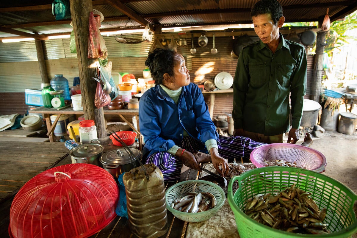 The canal means Phat No and her husband can harvest rice twice a year. The fish they catch complements their diet