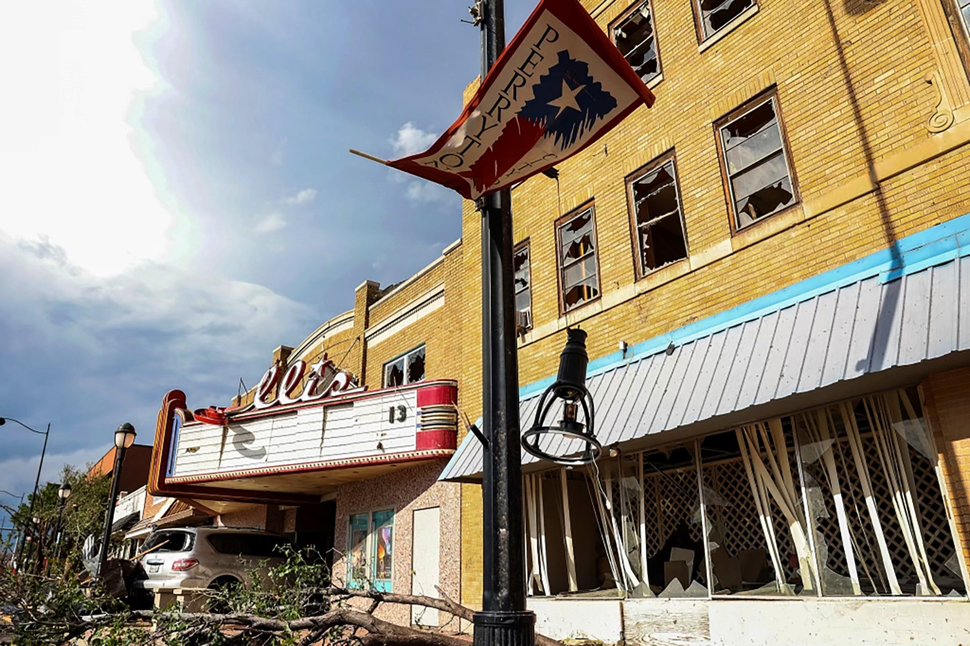 A vehicle sits at the entrance to the Ellis Theater after a tornado struck Perryton, Texas, on Thursday