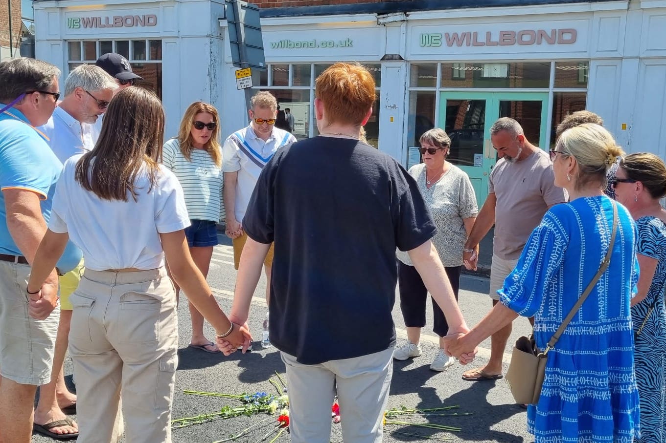 The family and friends of Barnaby Webber, including his father David (second left), visiting the scene (Webber family handout/PA)