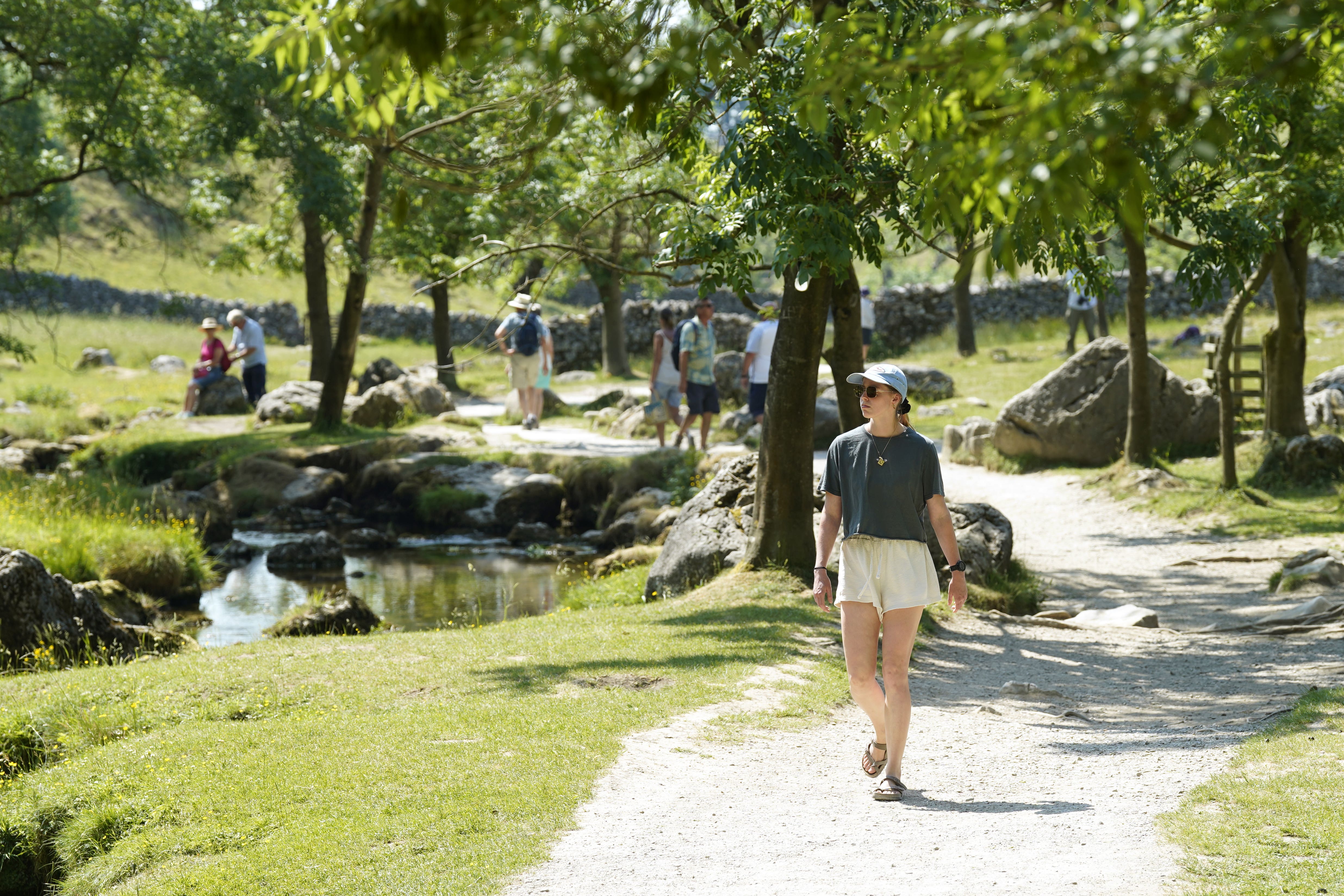 People enjoy the hot weather at Malham Cove, in the Yorkshire Dales National Park