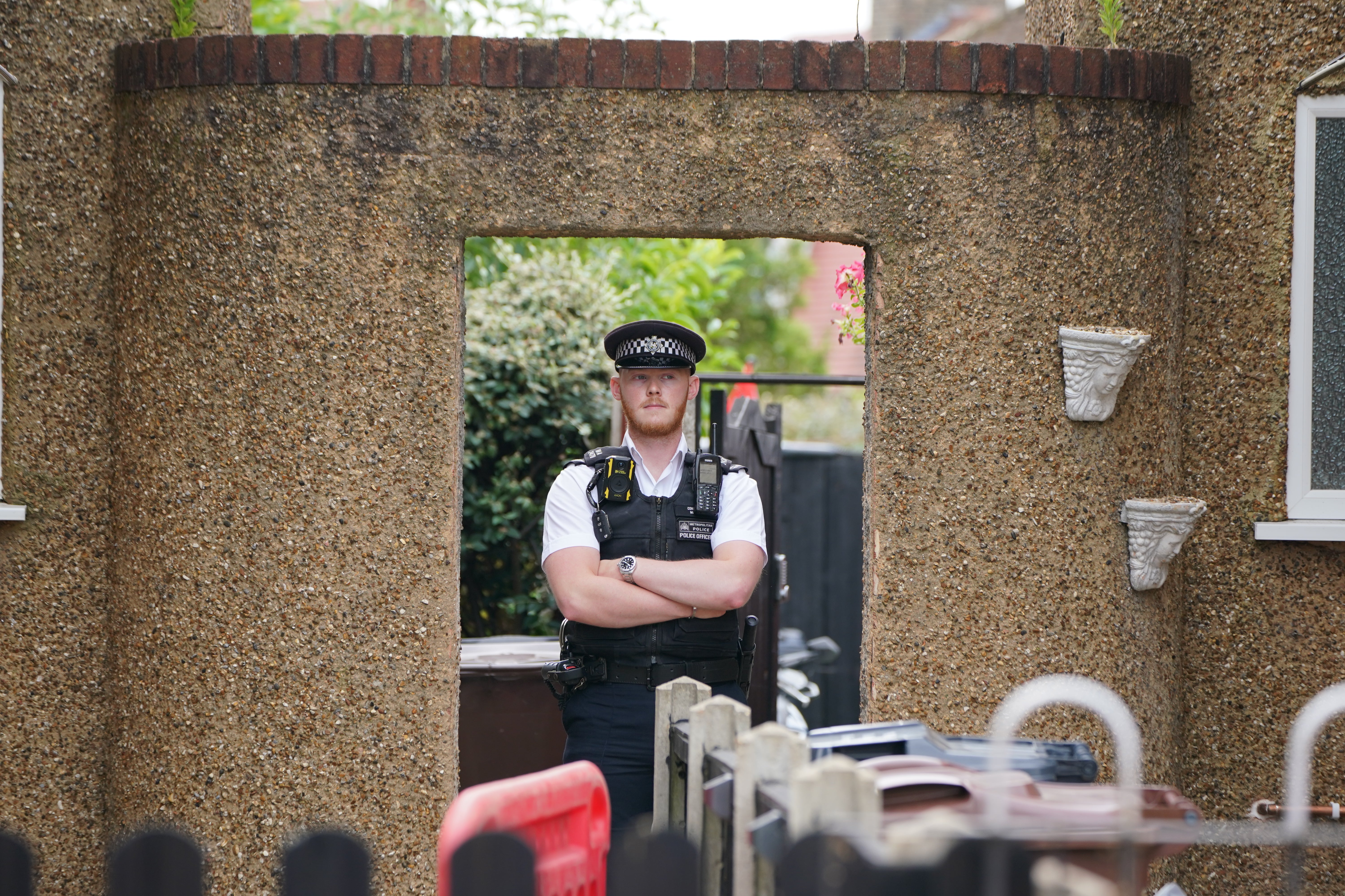 Just one police officer was stood with his arms folded outside the property on Saturday morning