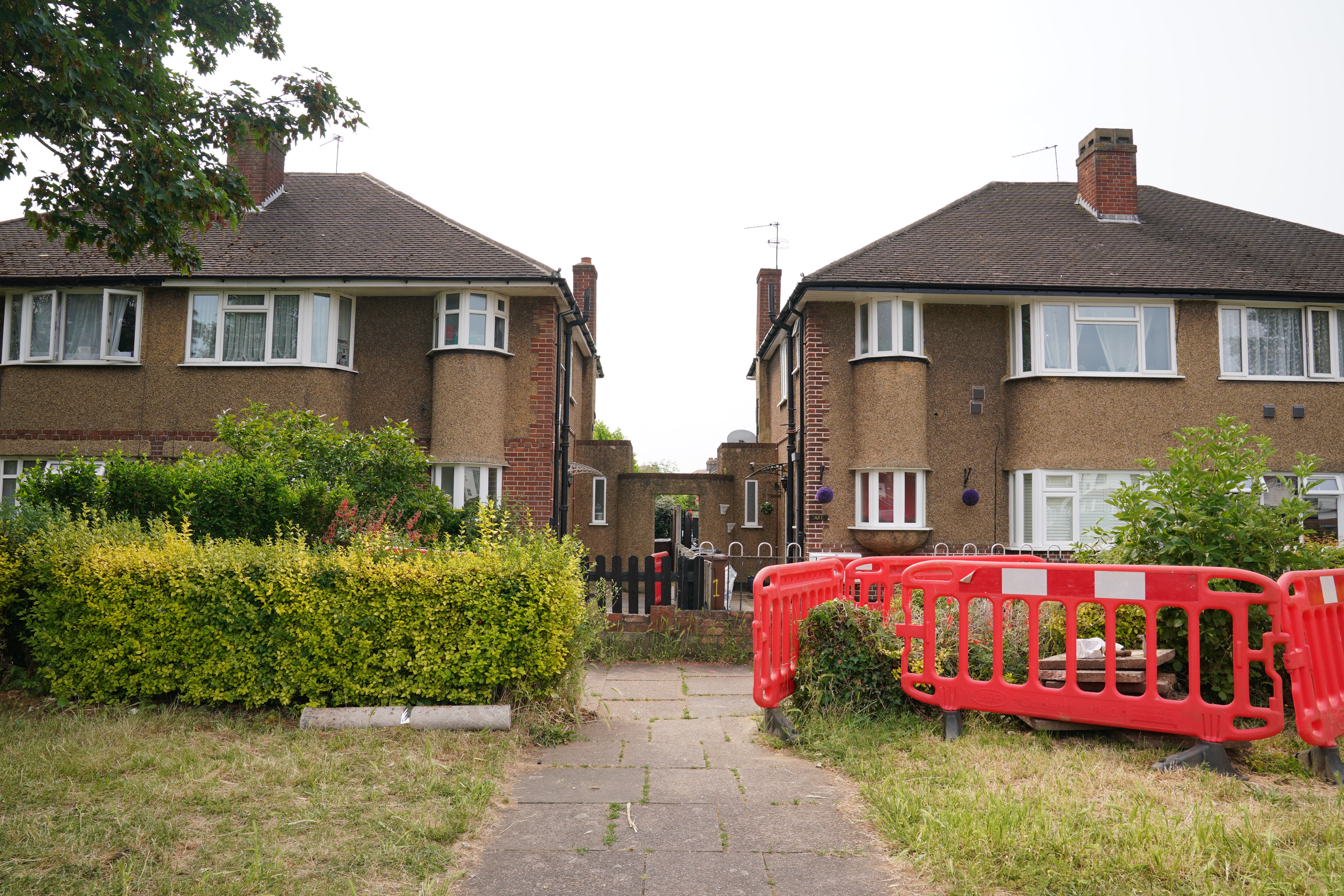 The property was cordoned off after the four bodies were discovered