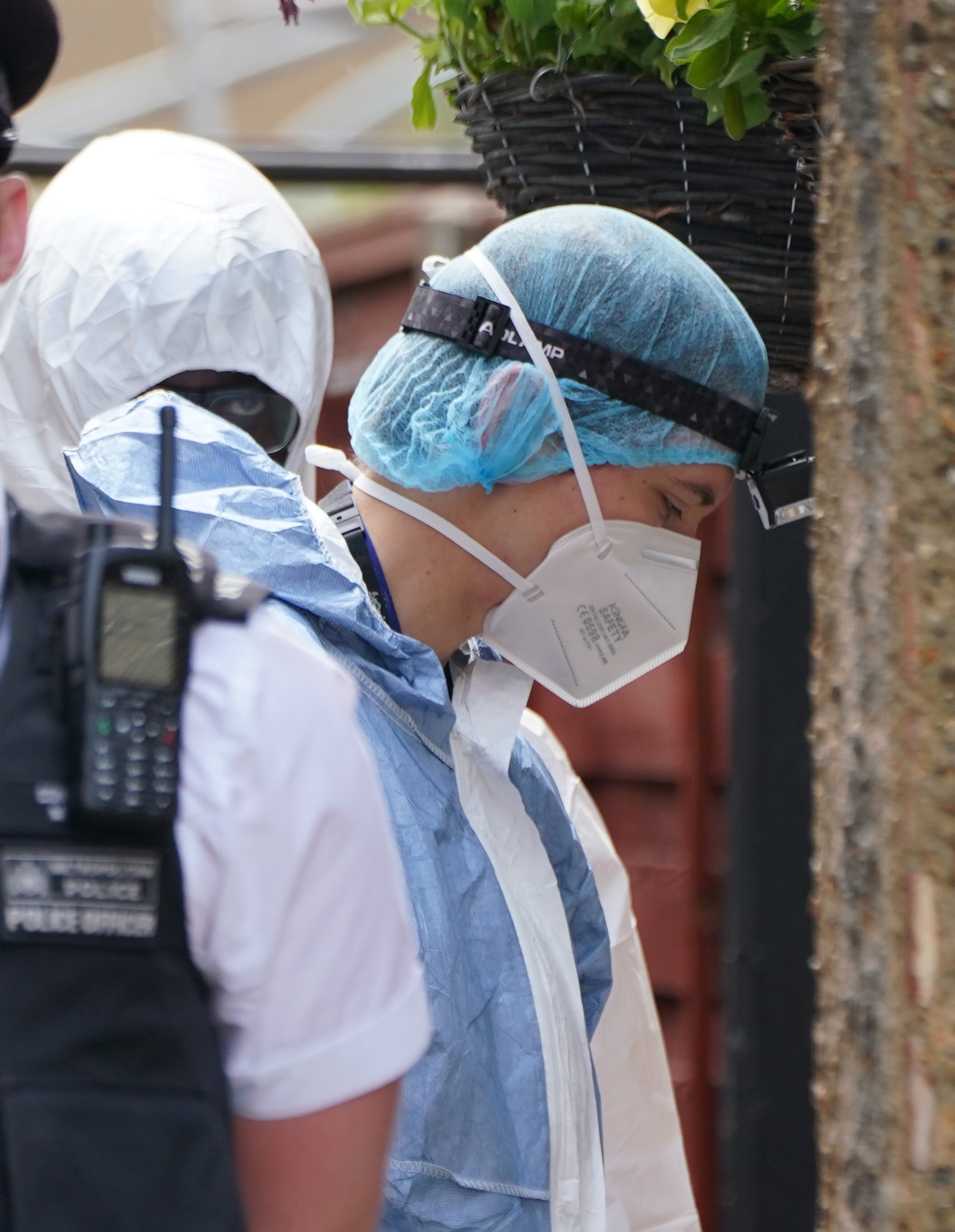 Police and forensic investigators at the scene in Bedfont, Hounslow