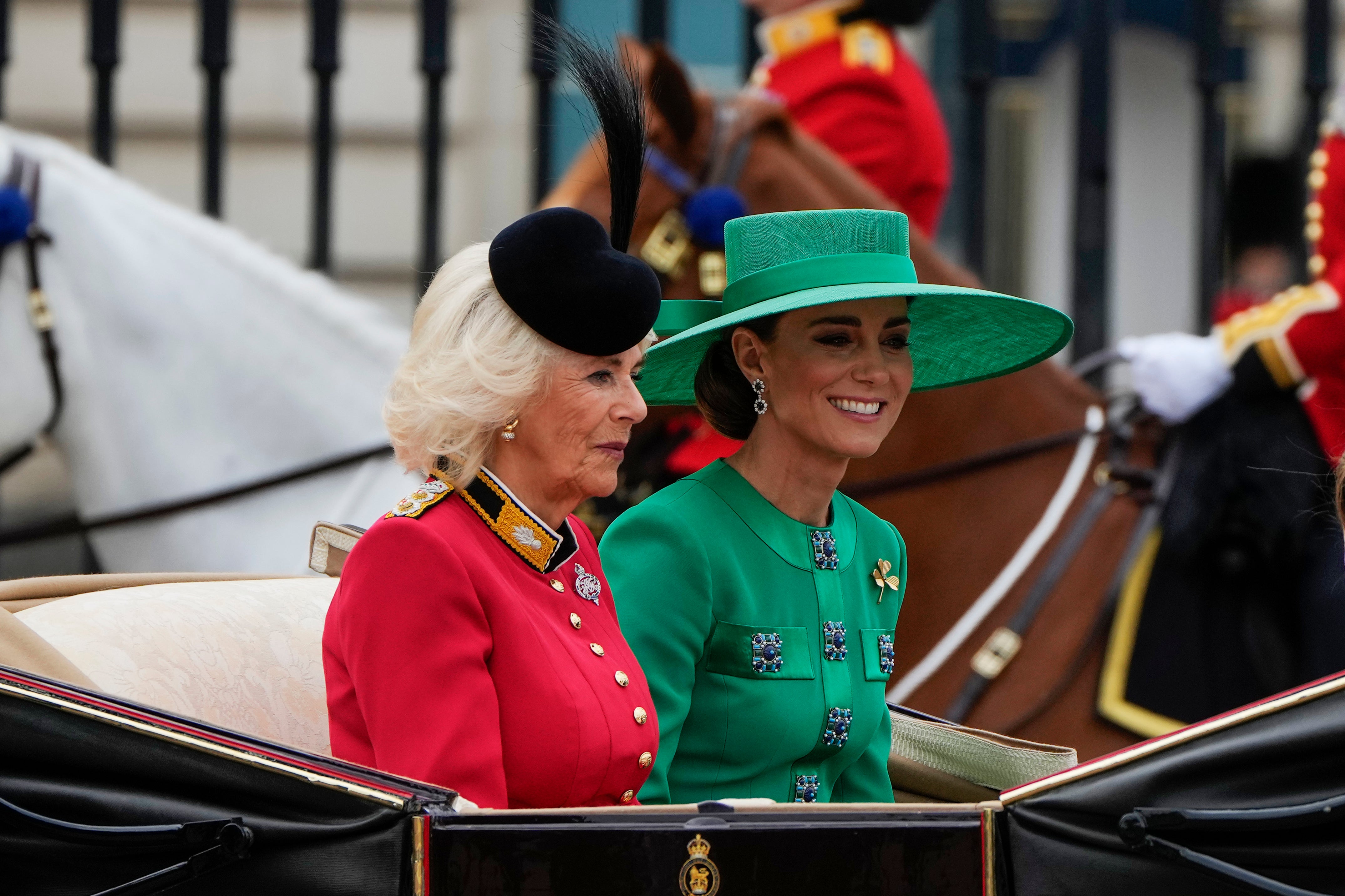 Queen Camilla and Princess Kate ride in an open-top carriage down The Mall as part of the King Charles’ first Trooping the Colour as monarch