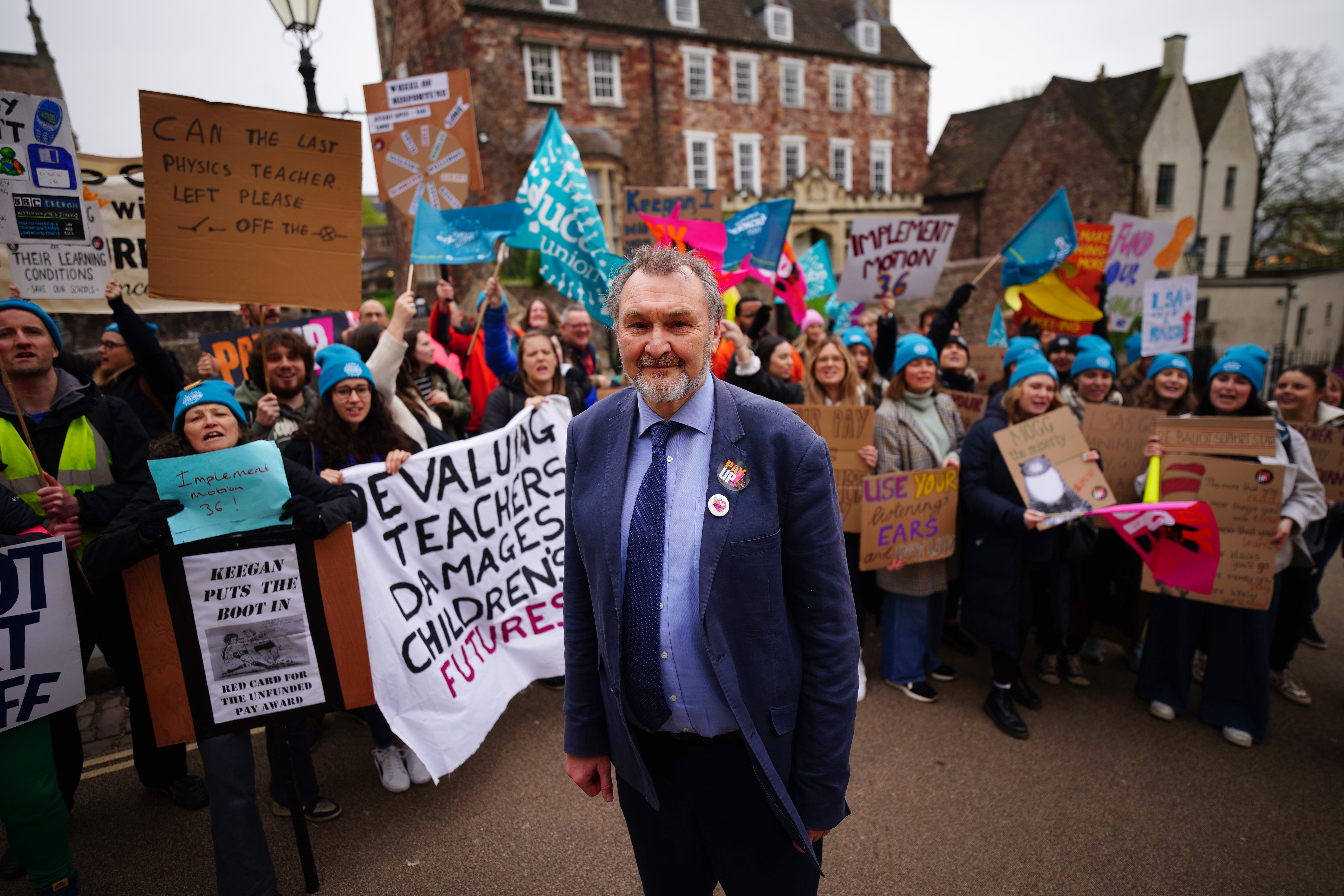 Kevin Courtney, joint general secretary of the National Education Union, with teachers on the picket line (PA)