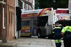 15 injured as Baltimore bus crashes into 2 cars, building