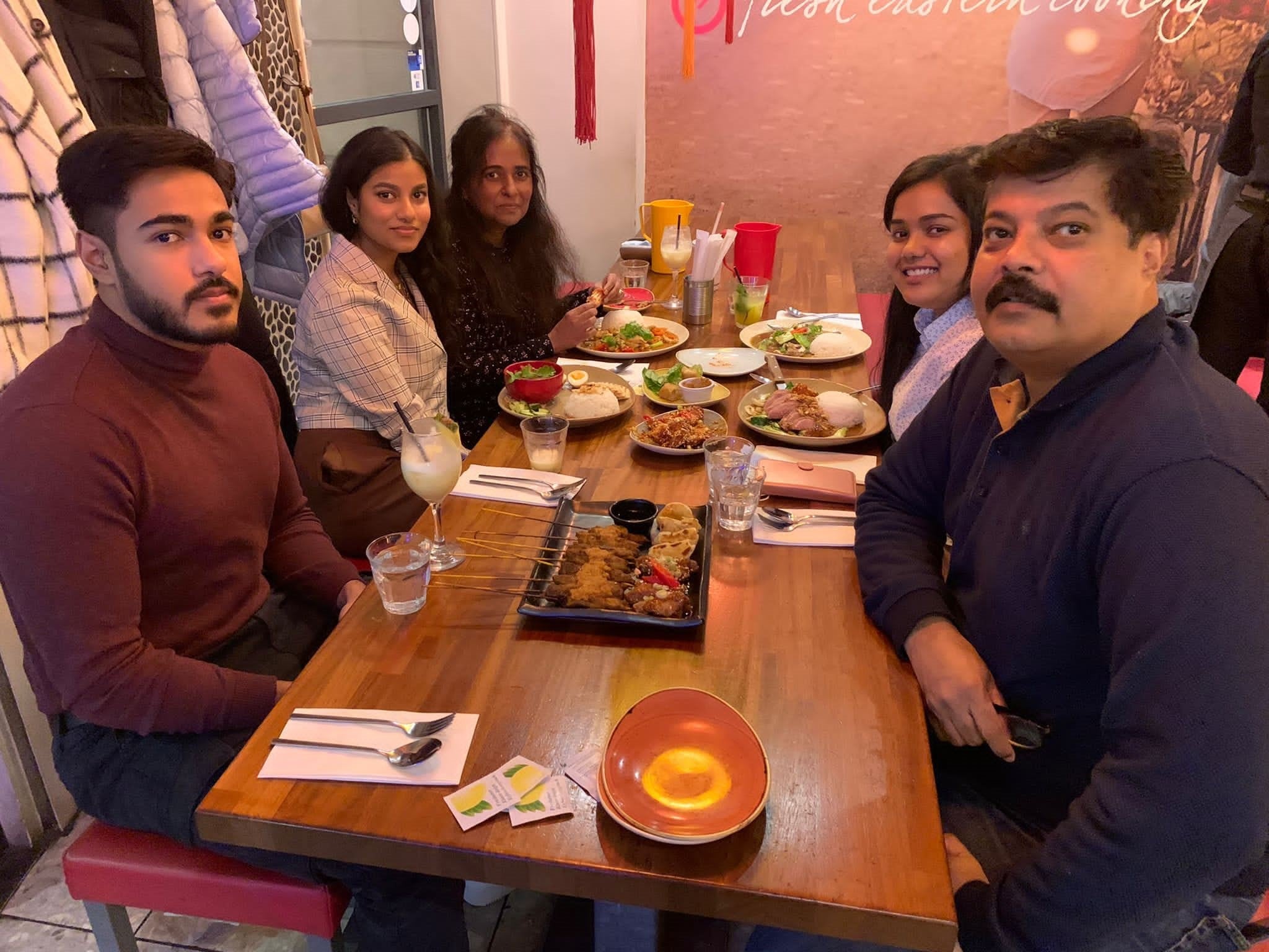 The Abraham family is demanding justice for Anugrah (left with, from left to right, his sister, his mother Sonia, his other sister, and his father Amar)