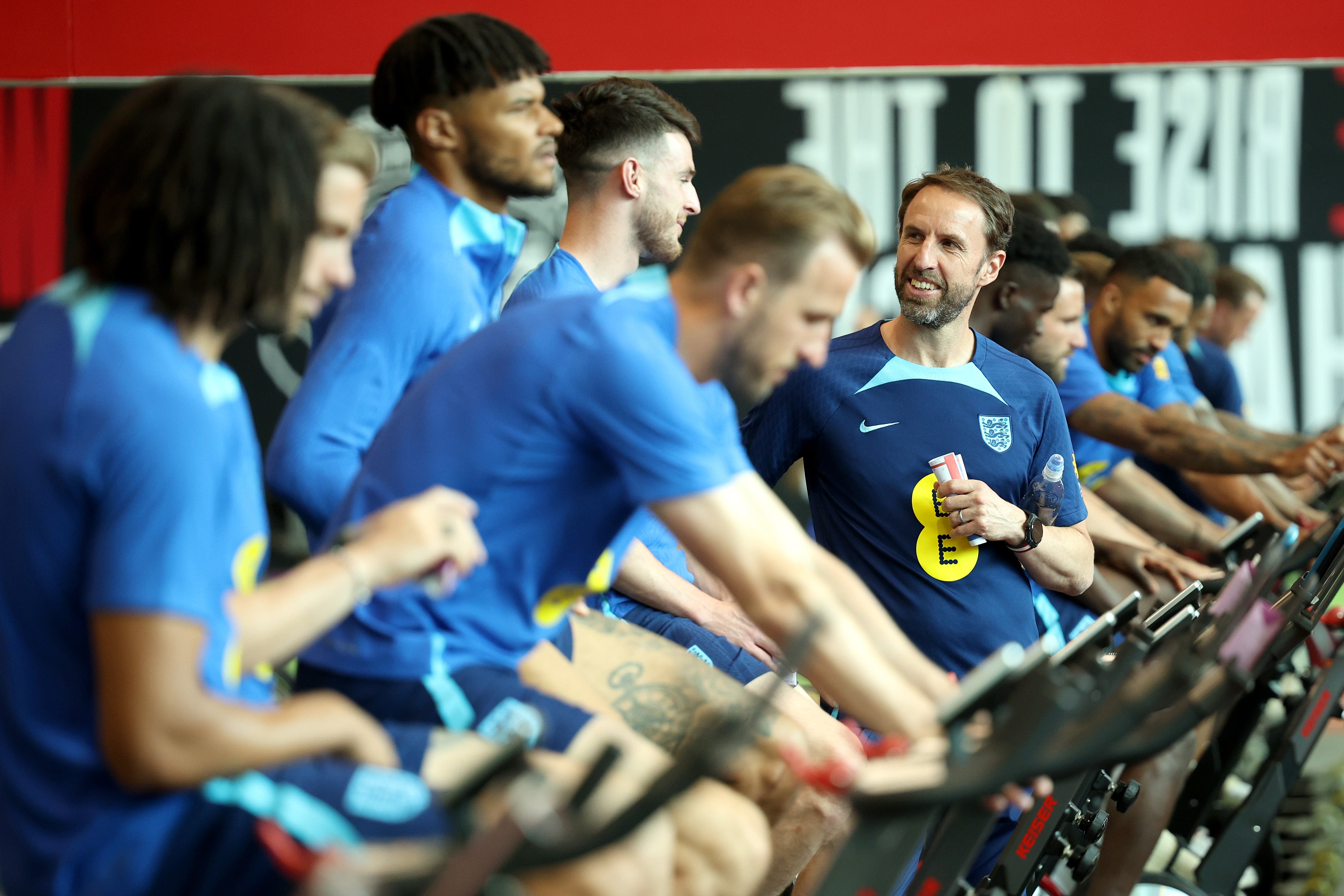 Gareth Southgate in discussion with Declan Rice during a bike session