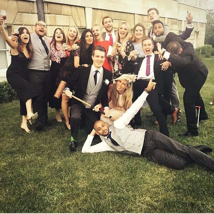 Carrie Johnson (bottom centre) pictured with Ben Mallet (bottom left) and other friends at a wedding in 2016