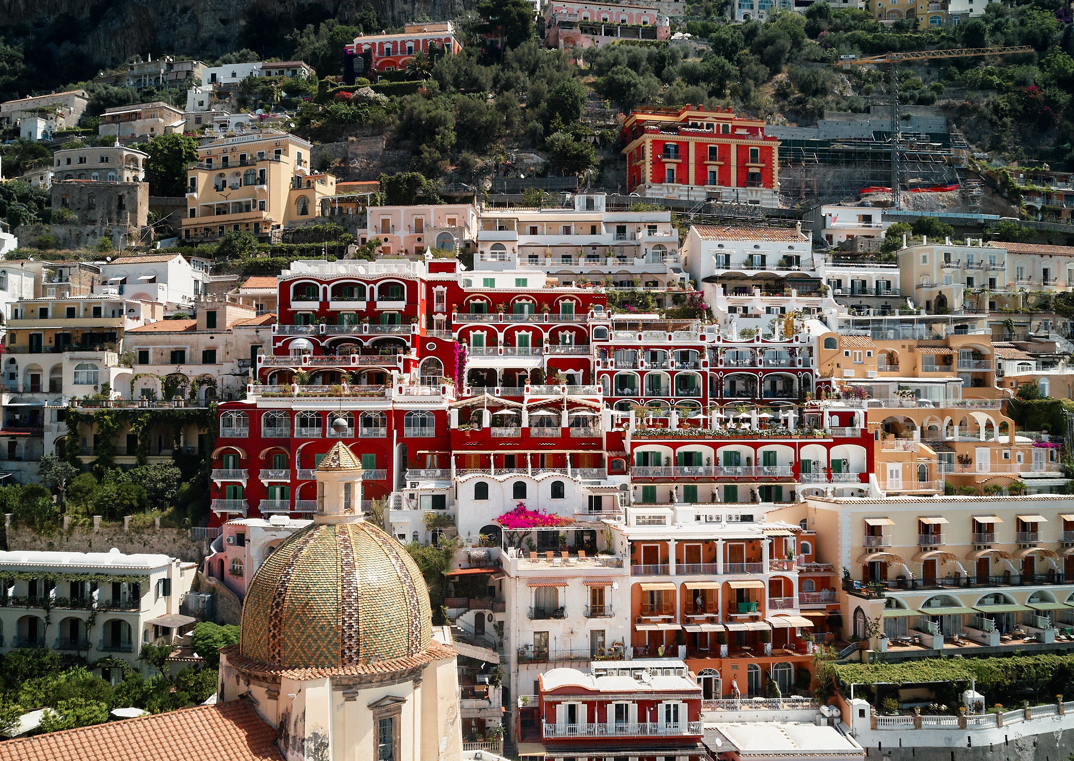 Le Sirenuse’s ‘Pompeii red’ facade greets you as you arrive into Positano by boat