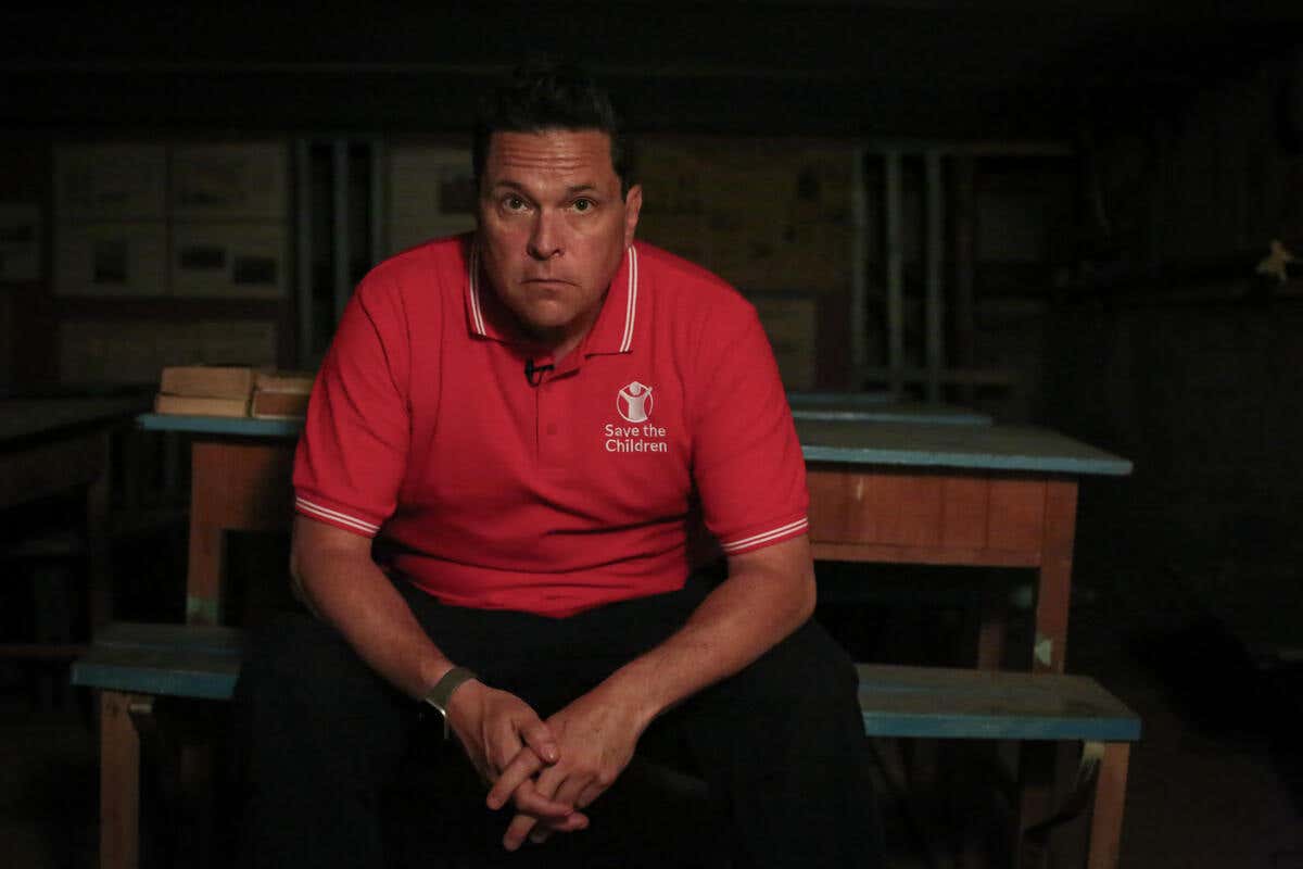 Dom Joly sits for a portrait in a bomb shelter Ukraine (Simon Edmunds/Save The Children/PA)