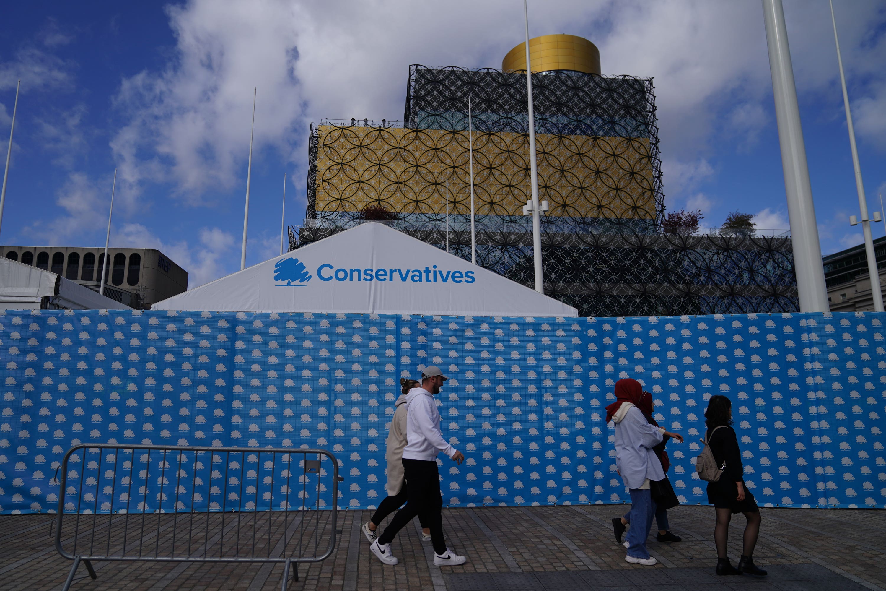 People walk past the International Convention Centre in Birmingham ahead of the Conservative Party annual conference (Aaron Chown/PA)