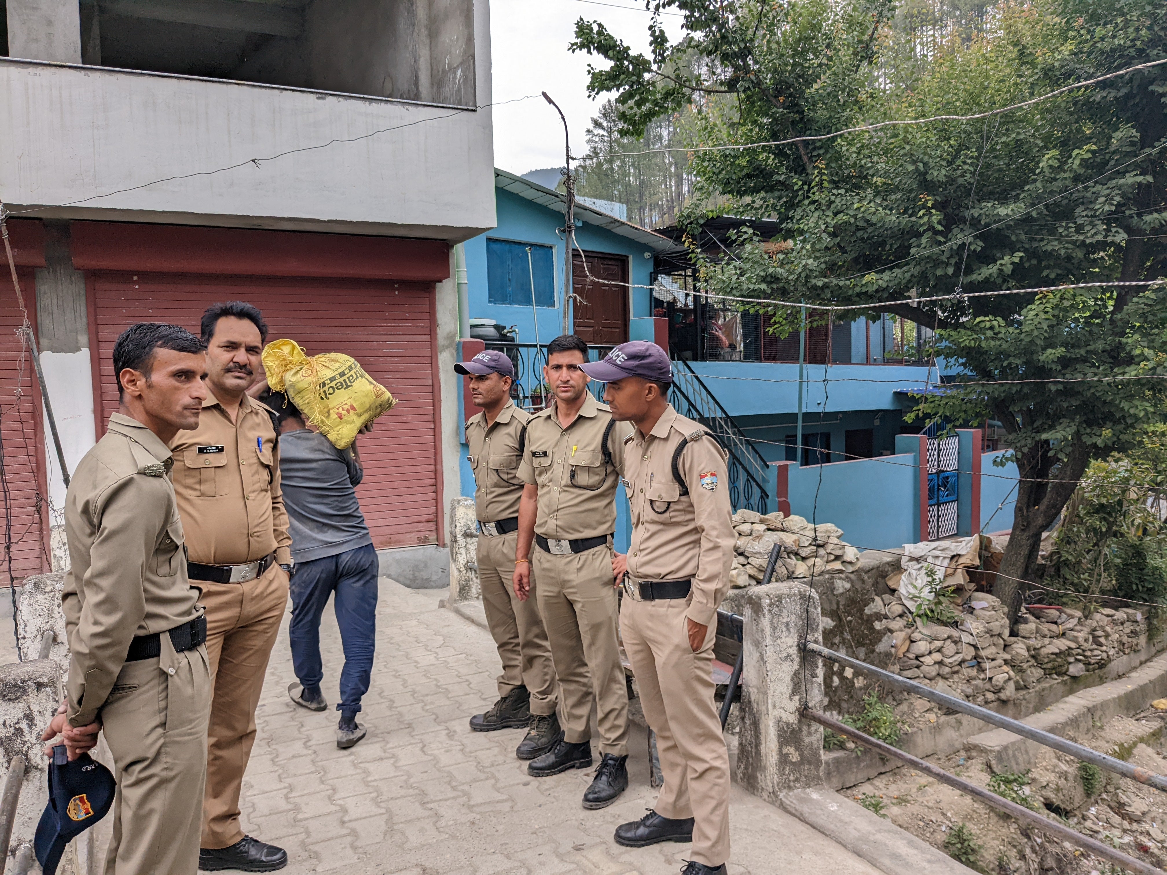 Police guarding the homes owned by resident muslim families in Purola