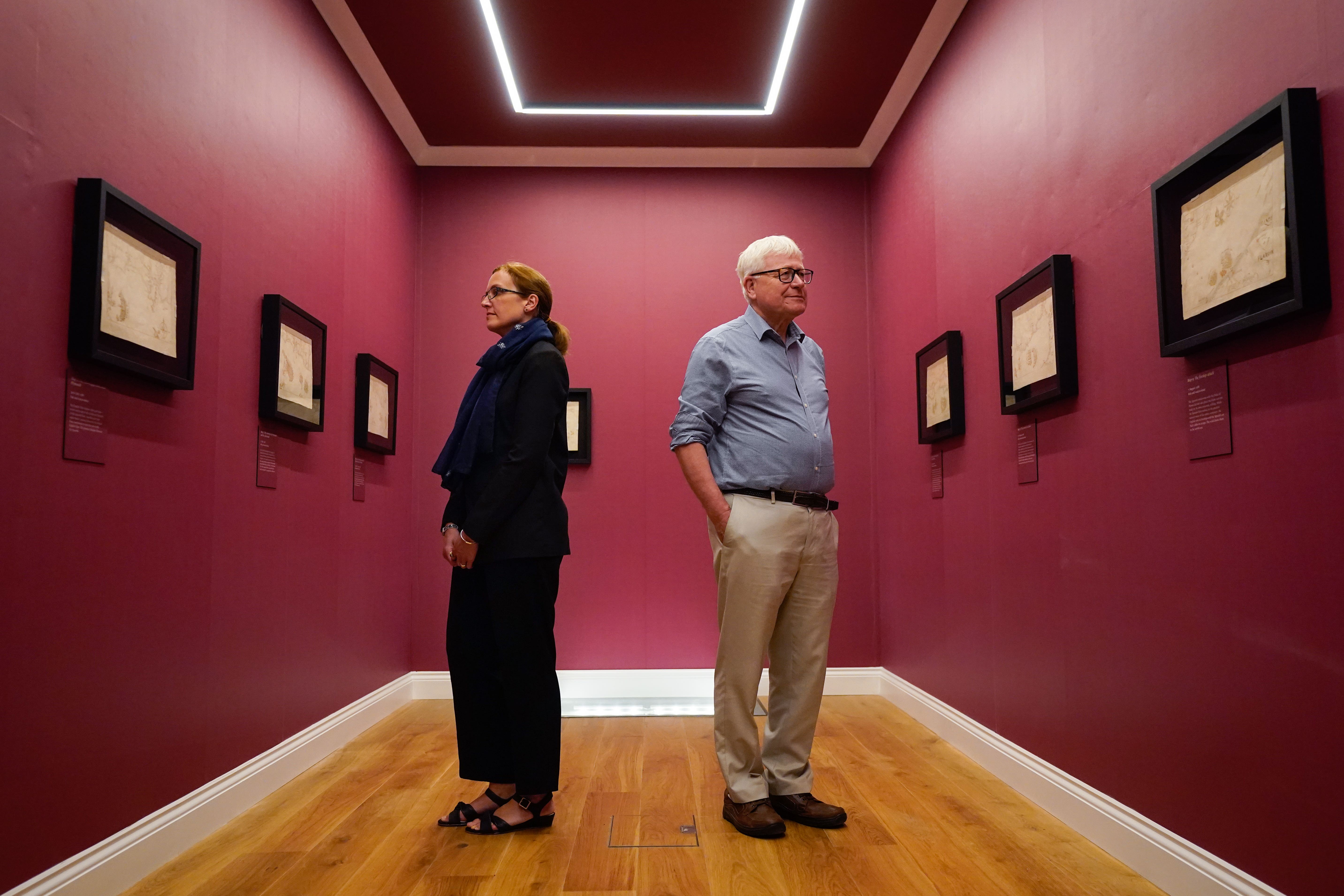 The National Museum of the Royal Navy’s director general, professor Dominic Tweddle (right), and head of collections and research, Louisa Blight, admire the maps ((Andrew Matthews/PA)