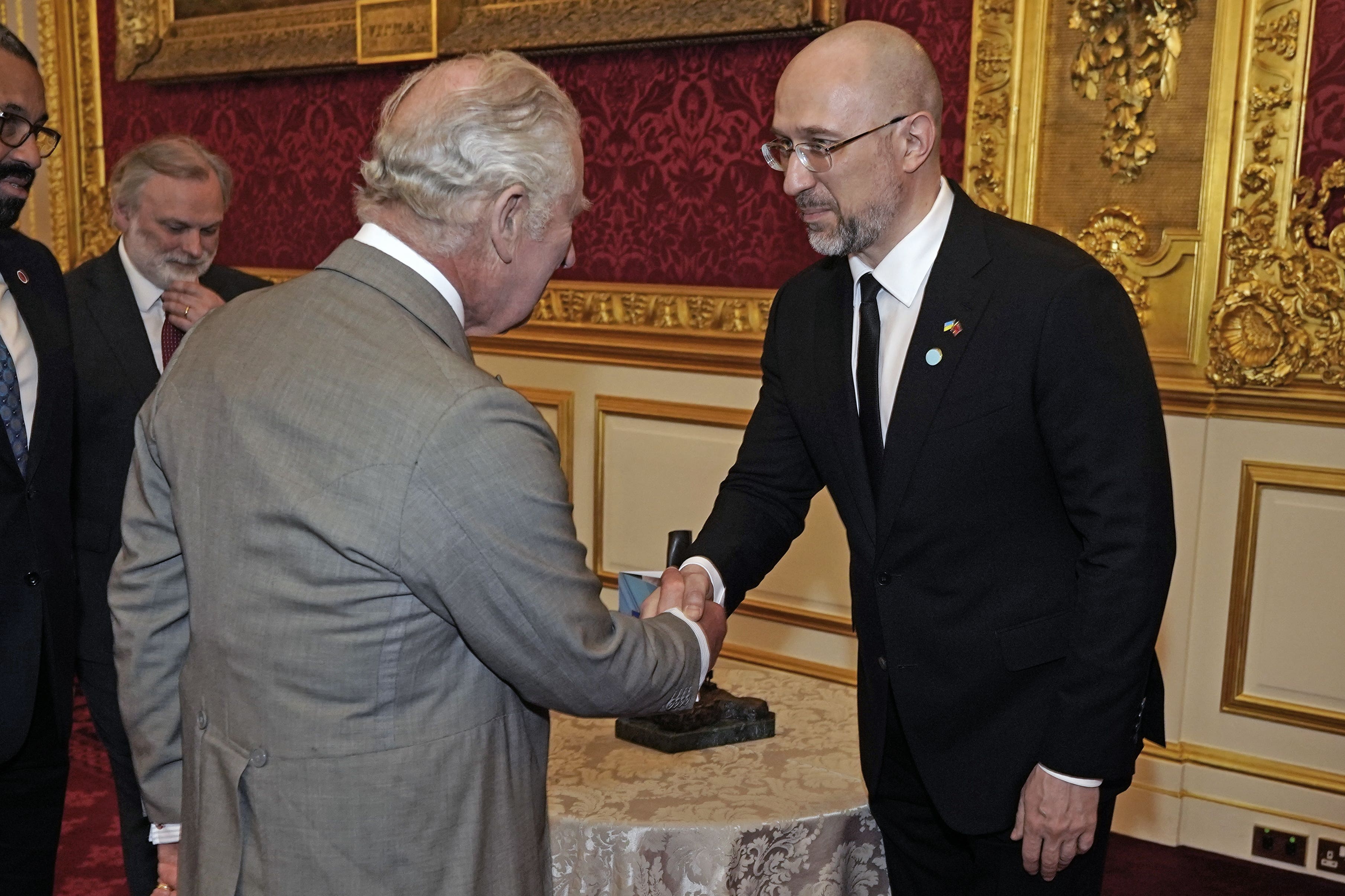 The King shakes hands with prime minister of Ukraine Denys Shmyhal (Aaron Chown/PA)