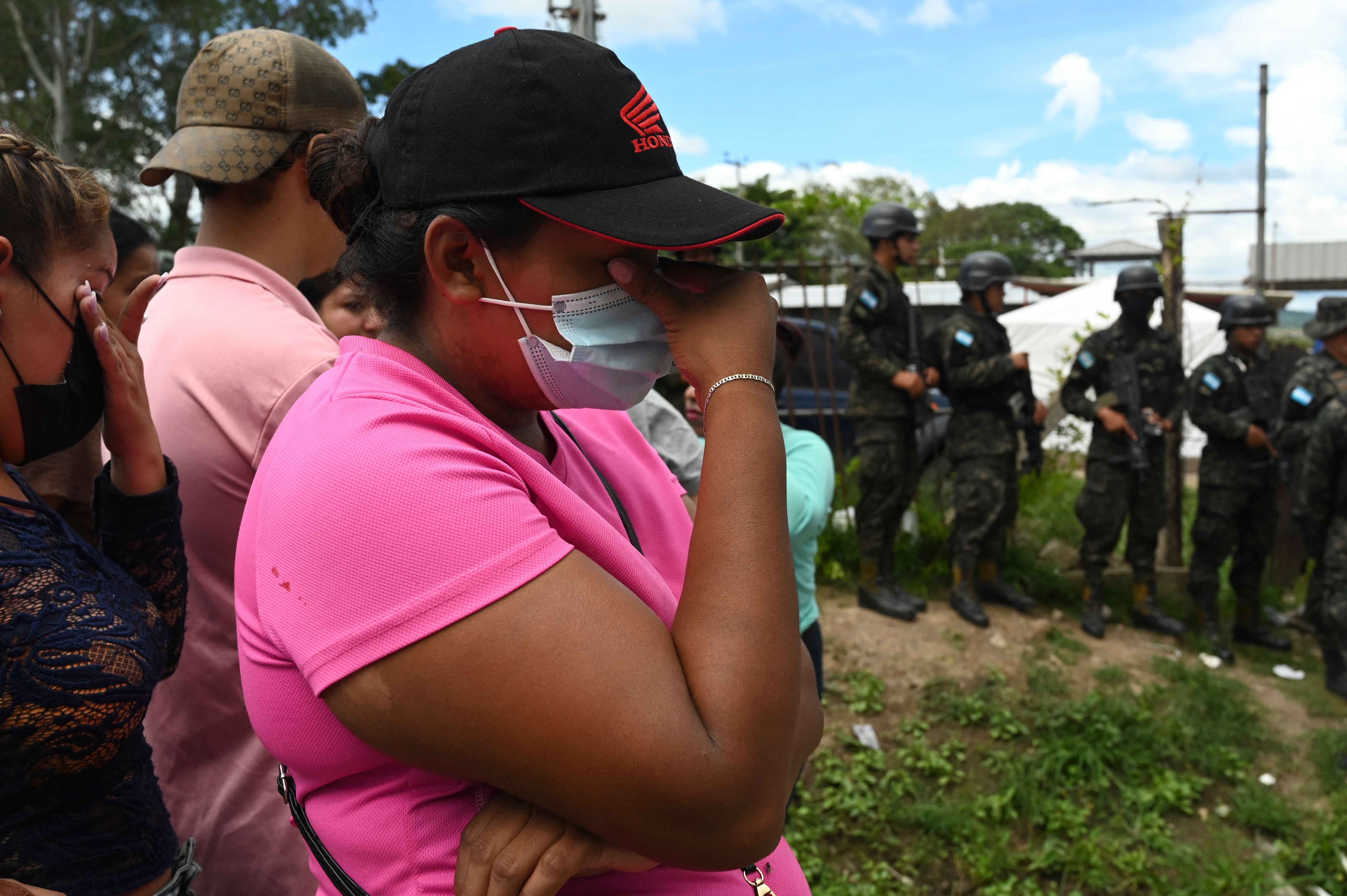 Relatives of inmates of the Women's Center for Social Adaptation (CEFAS) prison crie outside the detention center after a fire following a brawl between inmates in Tamara, some 25 kilometers from Tegucigalpa, Honduras, on June 20, 2023. Clashes between rival gangs at a woman's prison in Honduras left at least 41 people dead Tuesday, police told AFP. The violence took place at a prison some 25 kilometers (about 15 miles) north of the capital Tegucigalpa, according to police spokesman Edgardo Barahona, who put the "preliminary" toll at 41. (Photo by Orlando SIERRA / AFP) (Photo by ORLANDO SIERRA/AFP via Getty Images)