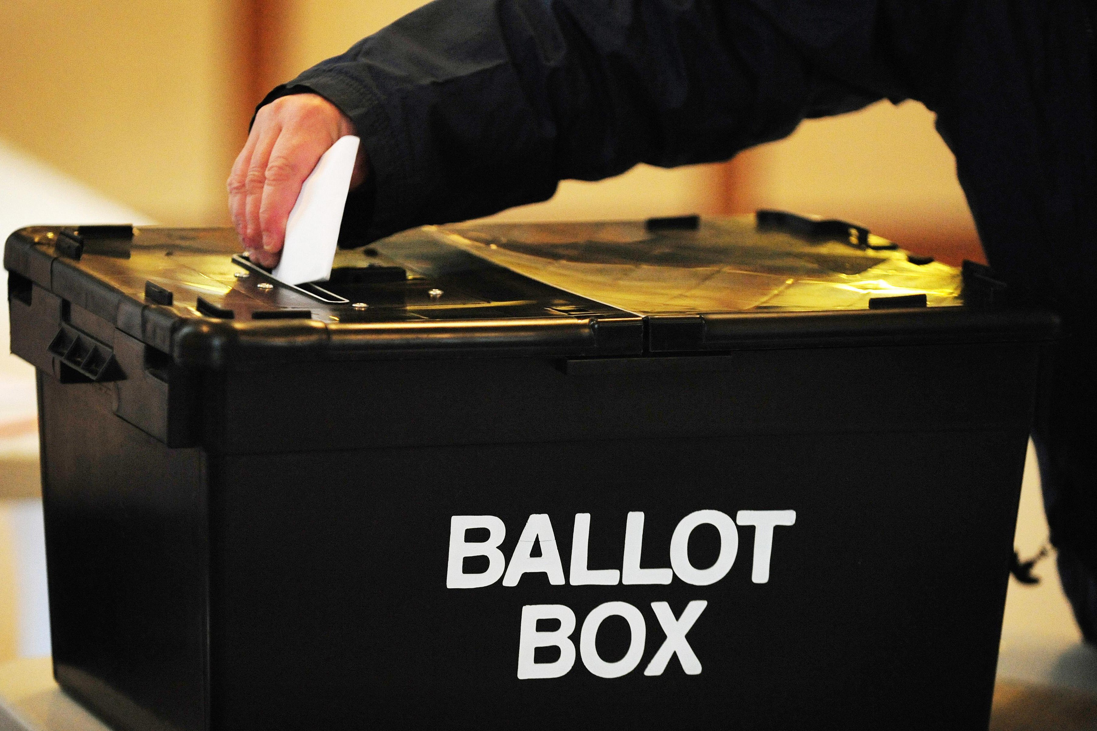 A voter placing a ballot paper in the ballot box (Rui Vieira/PA)