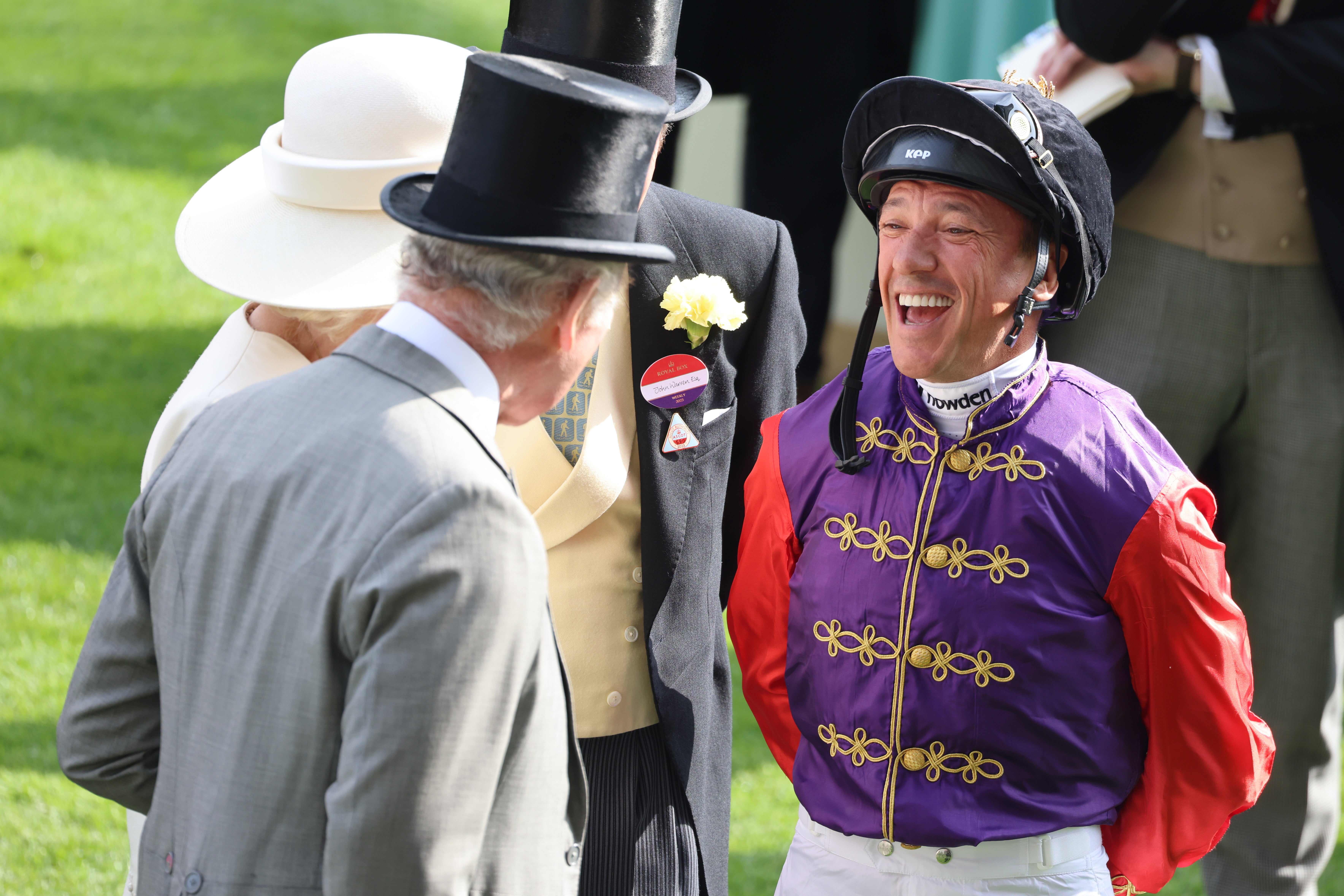 King Charles III, Queen Camilla and John Warren speak with Frankie Dettori