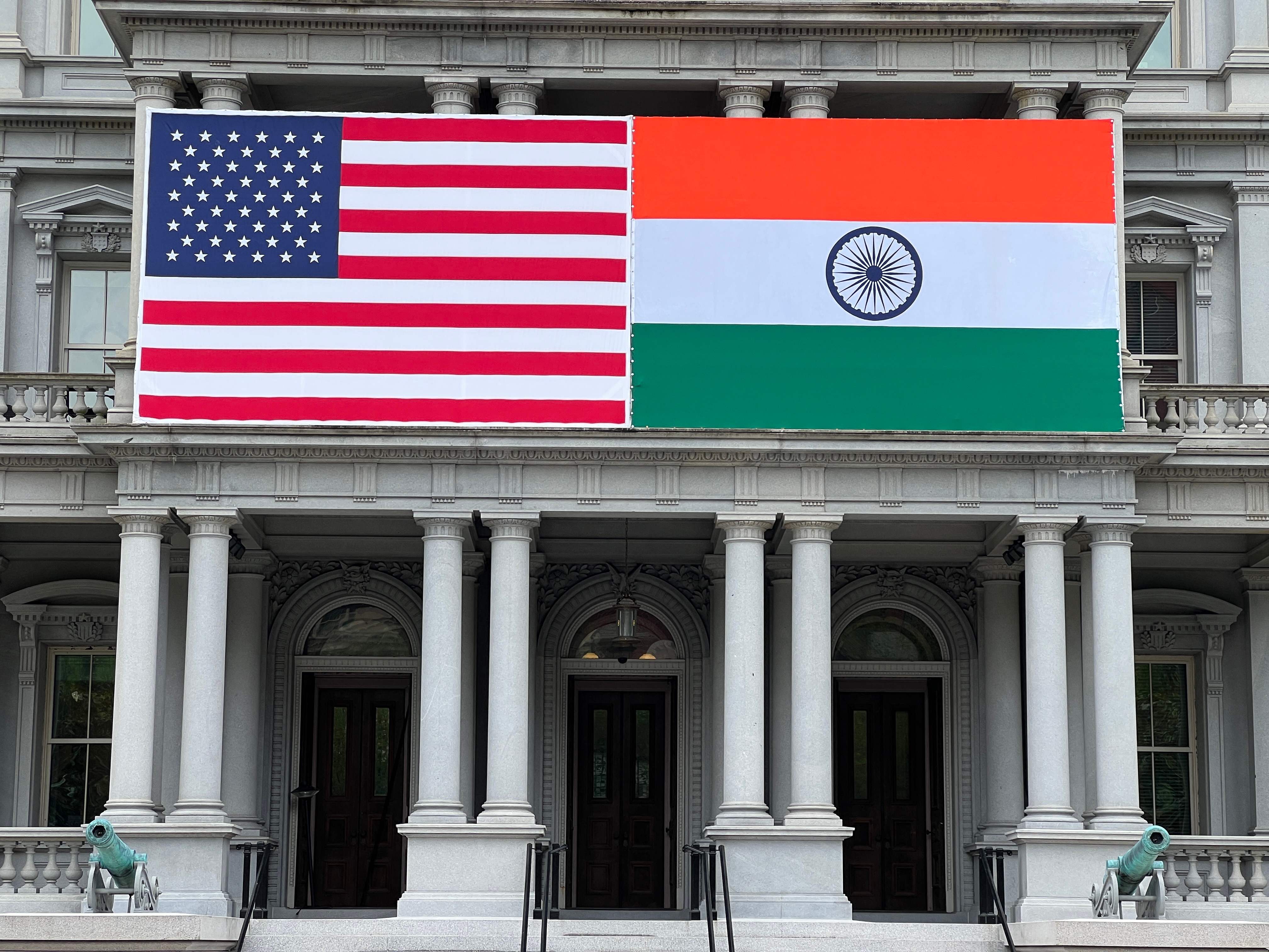 Flags of India and US adorn the Eisenhower Executive Office Building of the White House in Washington, DC on 20 June