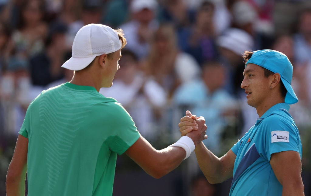 Ryan Peniston shakes hands with Holger Rune