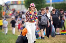 Initial bad weather does nothing to dampen spirits of Glastonbury festival-goers